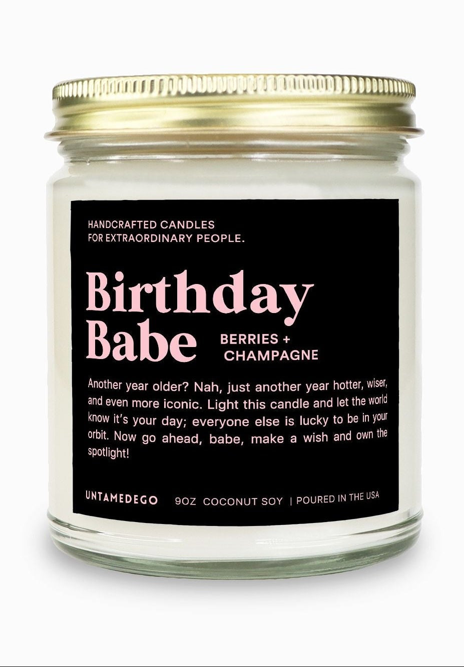 Candle jar labeled 'Birthday Babe' with a gold lid on a white background