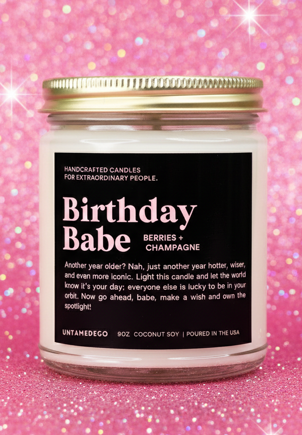 Candle labeled 'Birthday Babe' on a pink glittery background