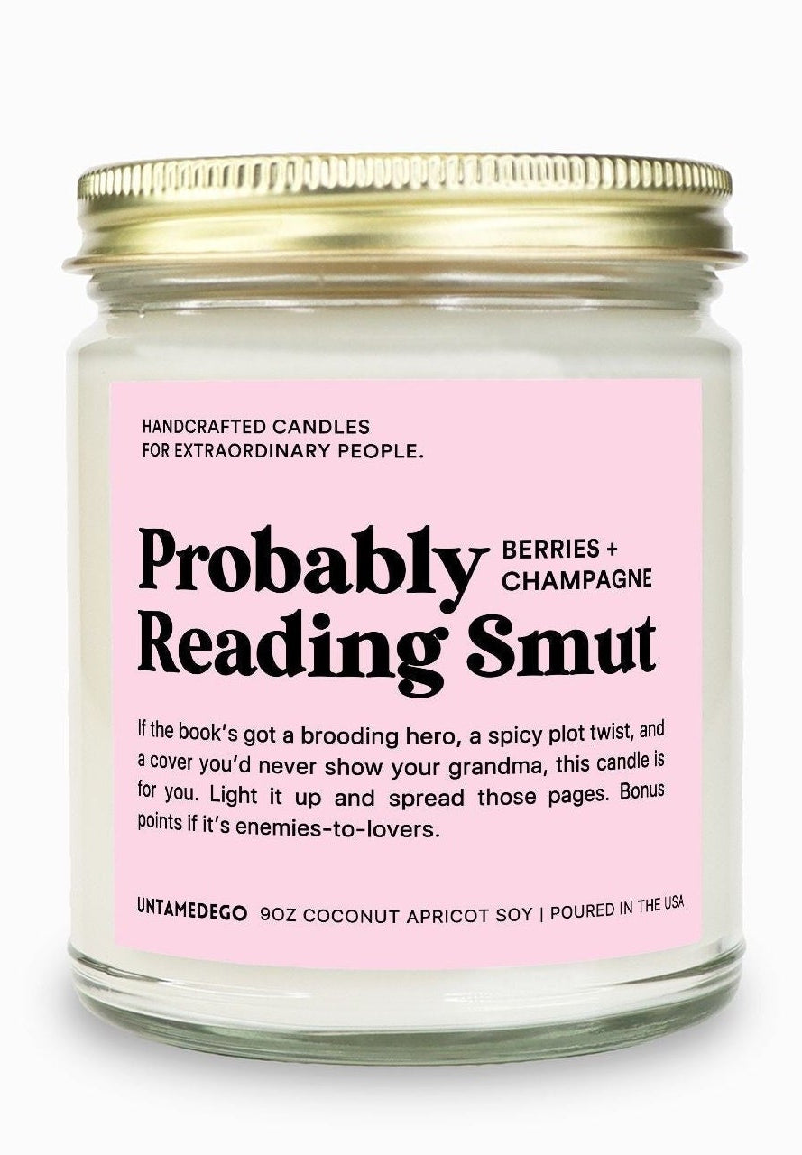 Candle with a pink label on a white background