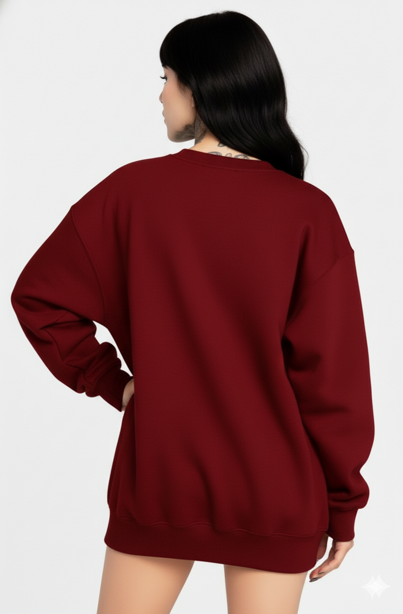 Person wearing a maroon sweatshirt on a white background