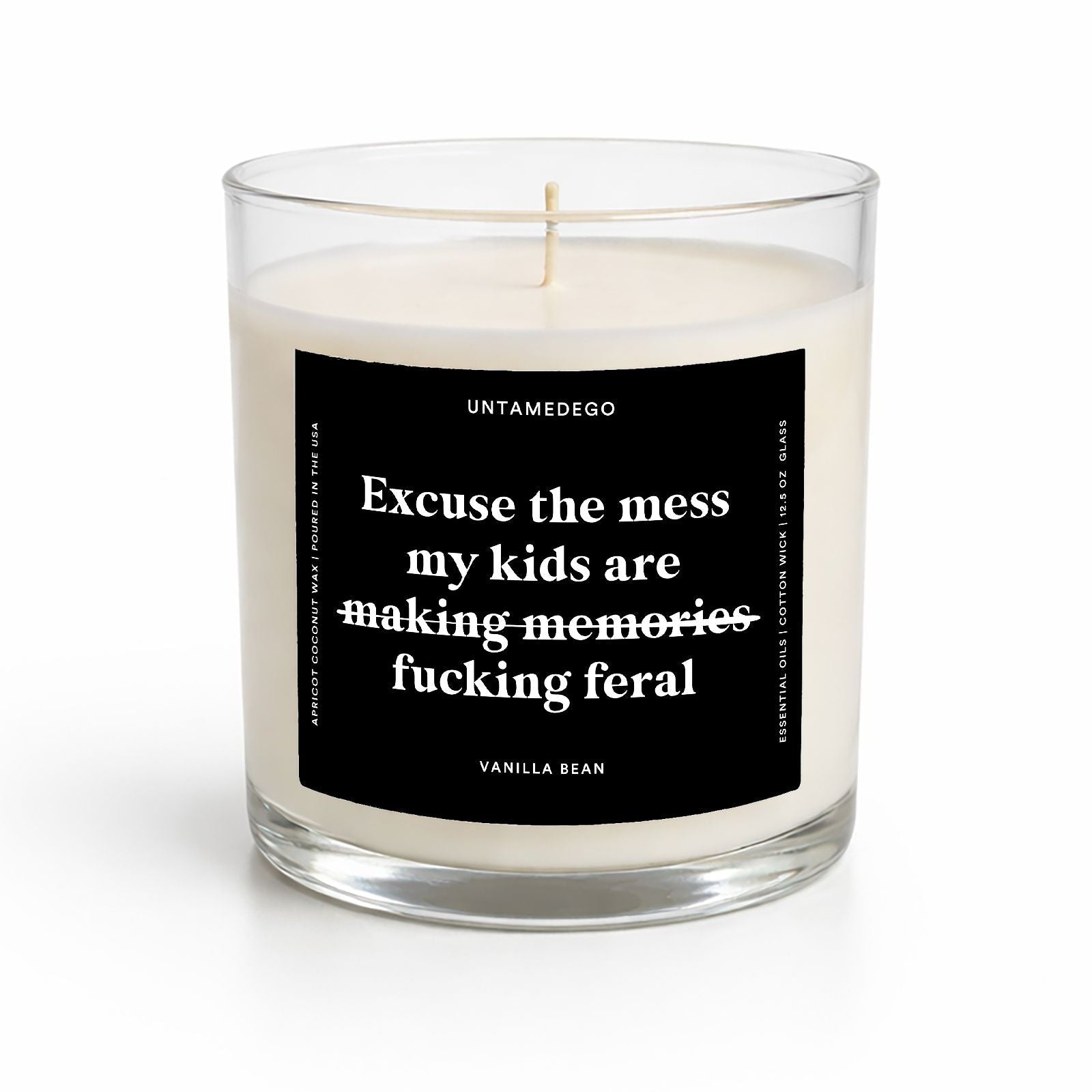 Candle with a black label featuring text on a white background