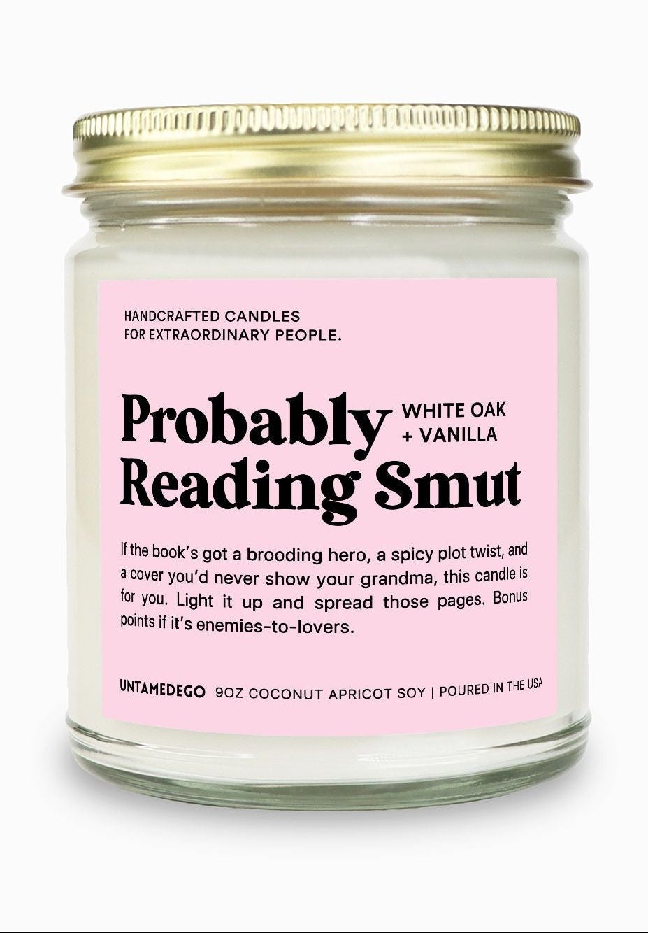 Candle jar with pink label on a white background