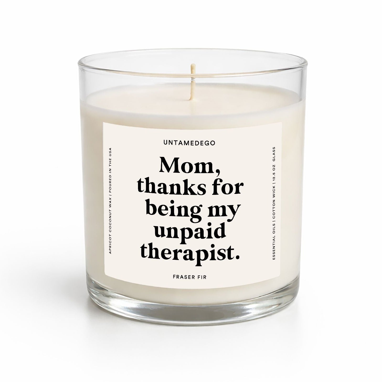 Candle in a glass jar with a label on a white background