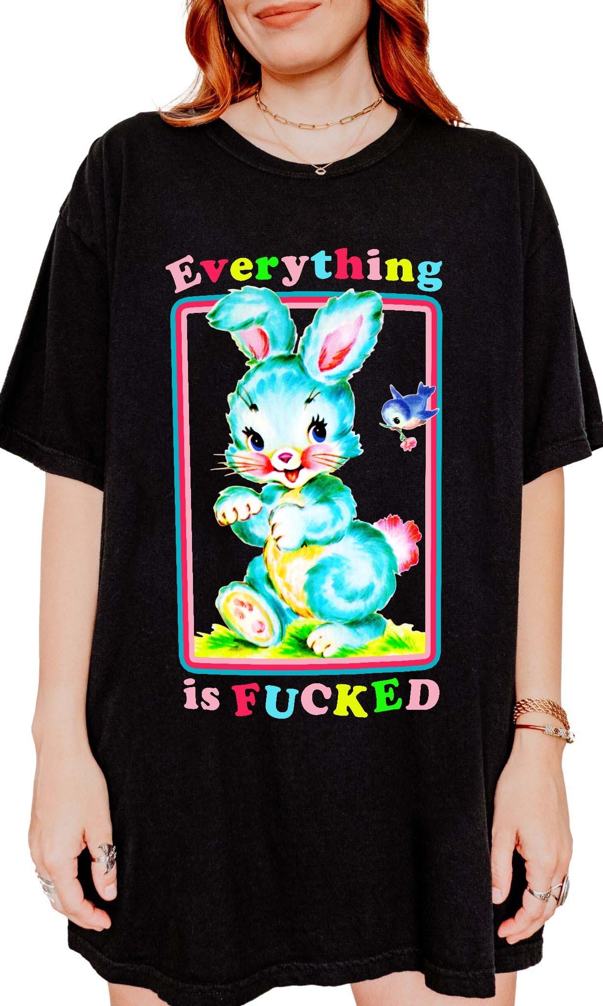 Funny graphic t-shirt with cute bunny illustration and text saying everything is fucked