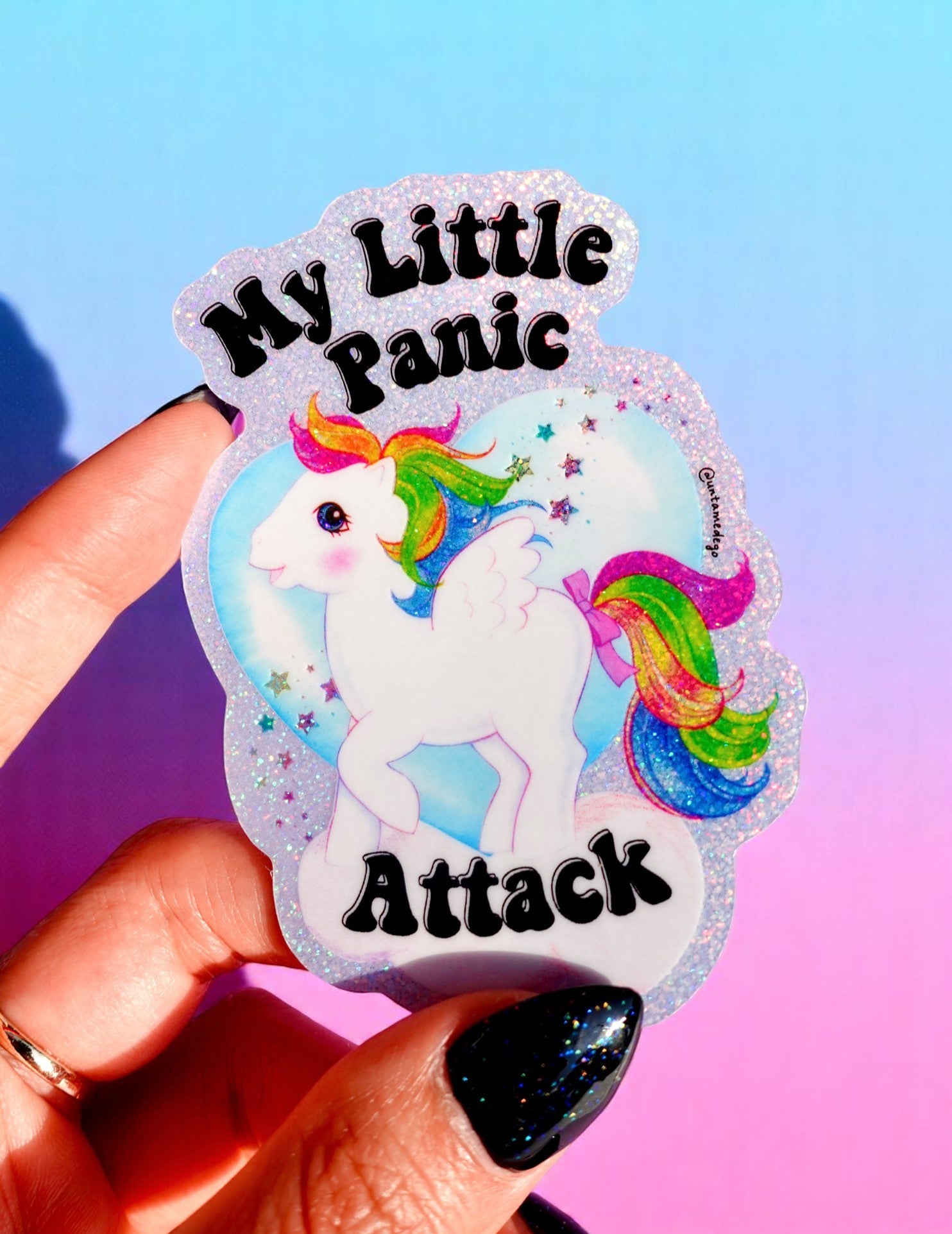 Funny holographic vinyl sticker with rainbow unicorn and black text reading “My Little Panic Attack.” Waterproof and glittery pastel aesthetic.