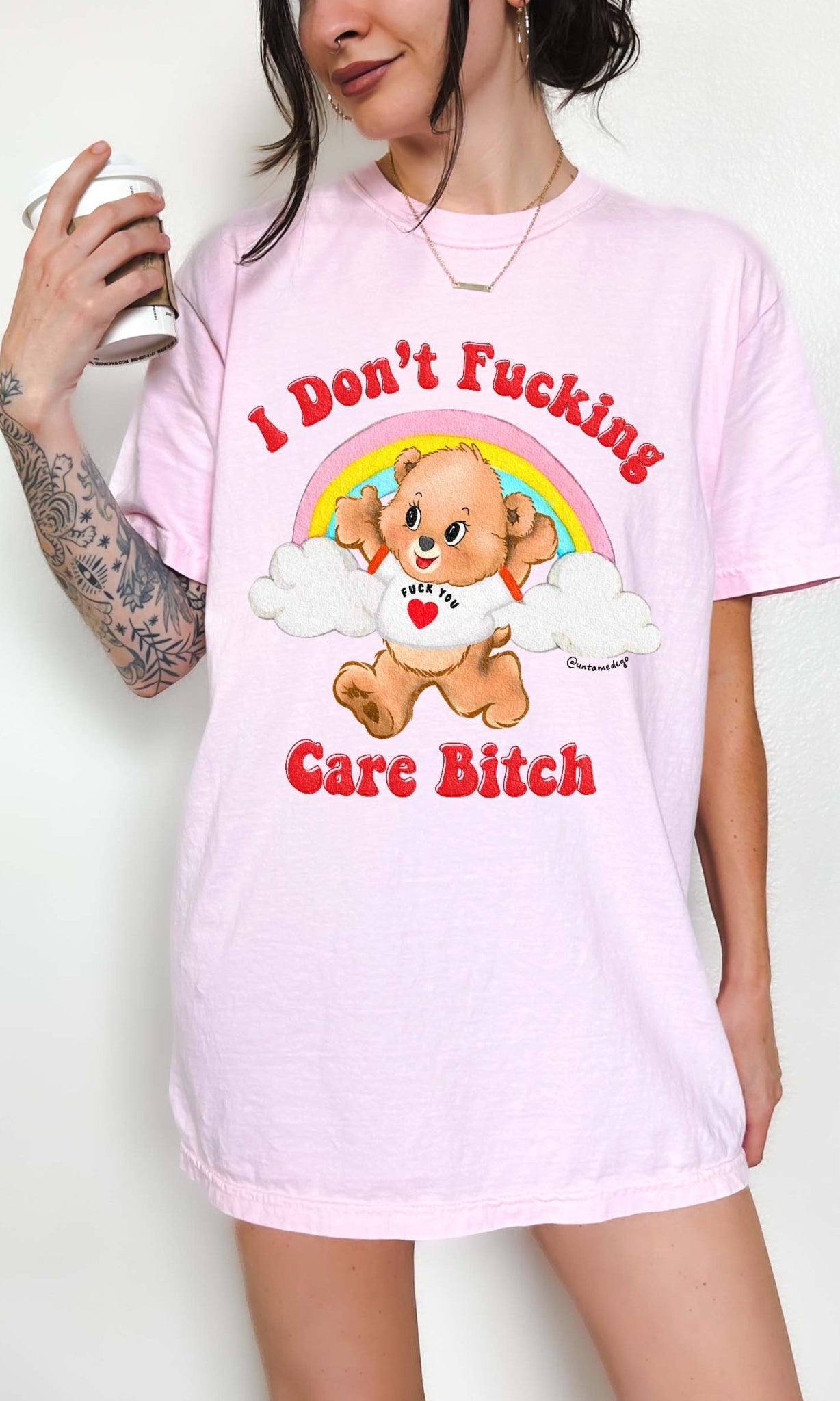 Funny graphic t-shirt with cute bear and rainbow design and bold text expressing not caring attitude
