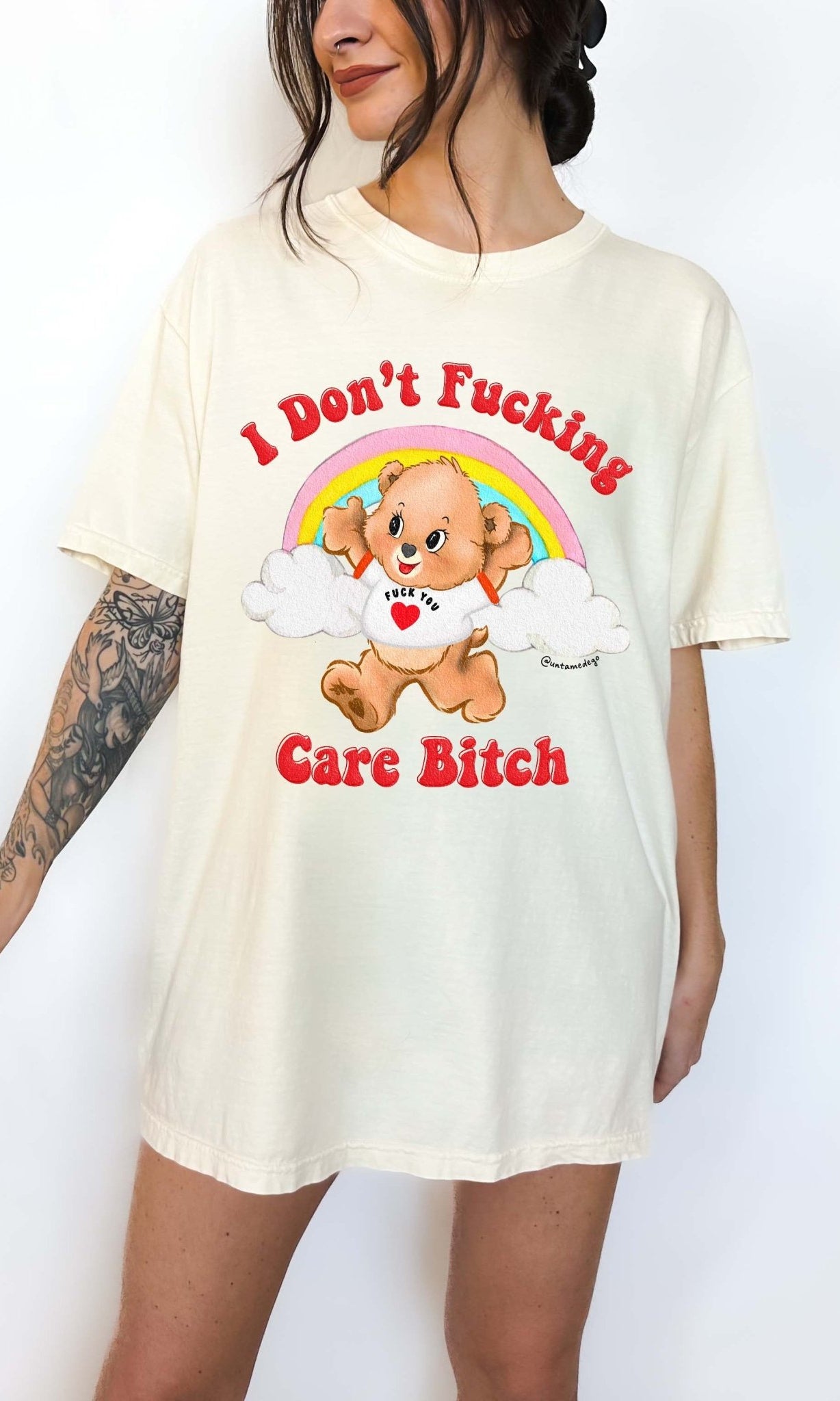 Funny graphic t-shirt with cute bear and rainbow design and bold text expressing not caring attitude