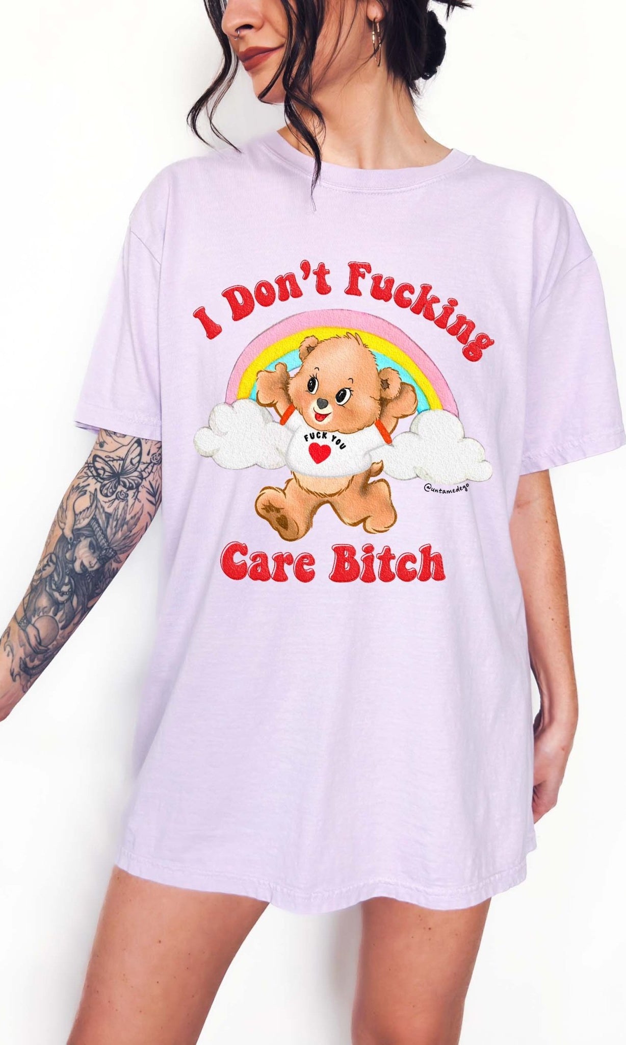 Funny graphic t-shirt with cute bear and rainbow design and bold text expressing not caring attitude