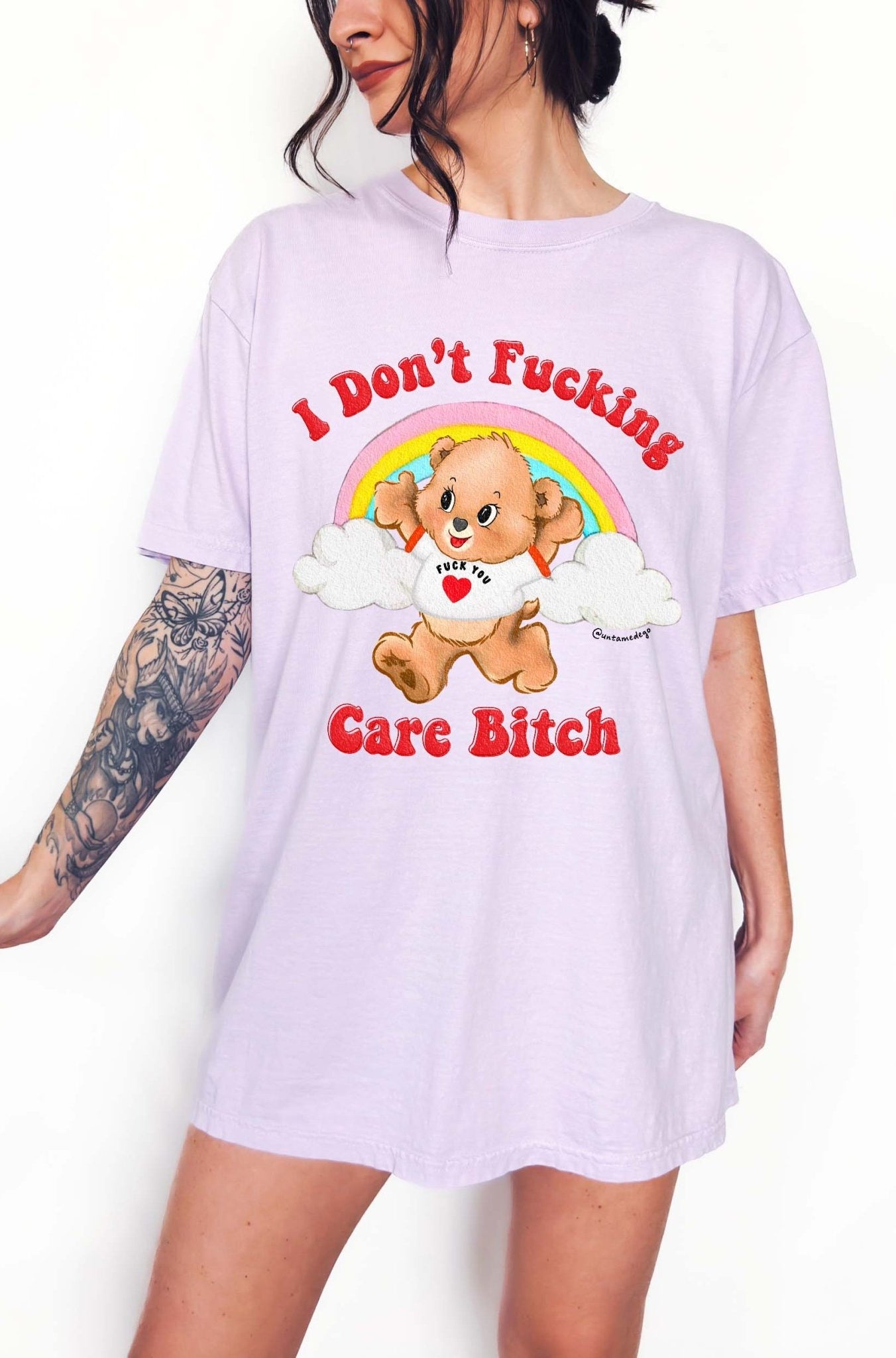 Funny graphic t-shirt with cute bear and rainbow design and bold text expressing not caring attitude