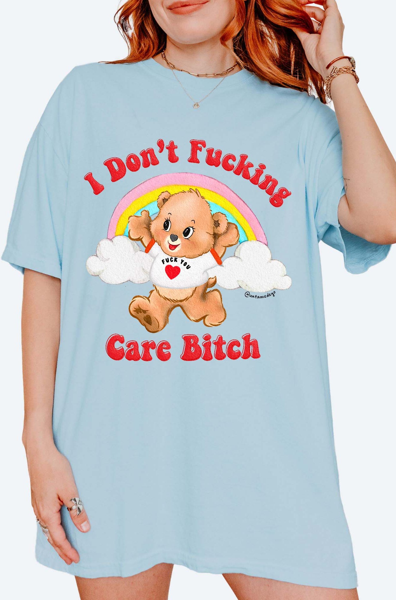 Funny graphic t-shirt with cute bear and rainbow design and bold text expressing not caring attitude