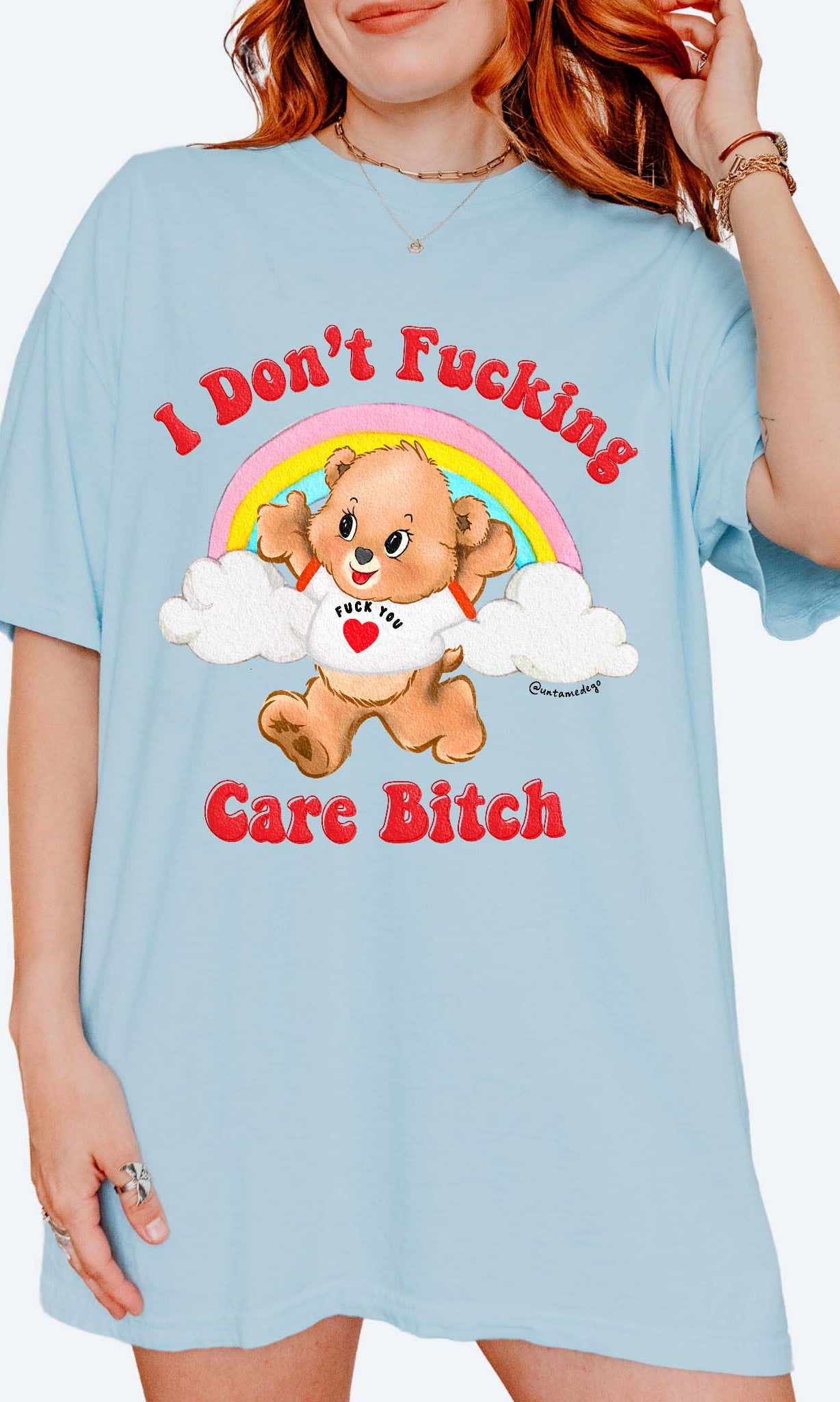 Funny graphic t-shirt with cute bear and rainbow design and bold text expressing not caring attitude