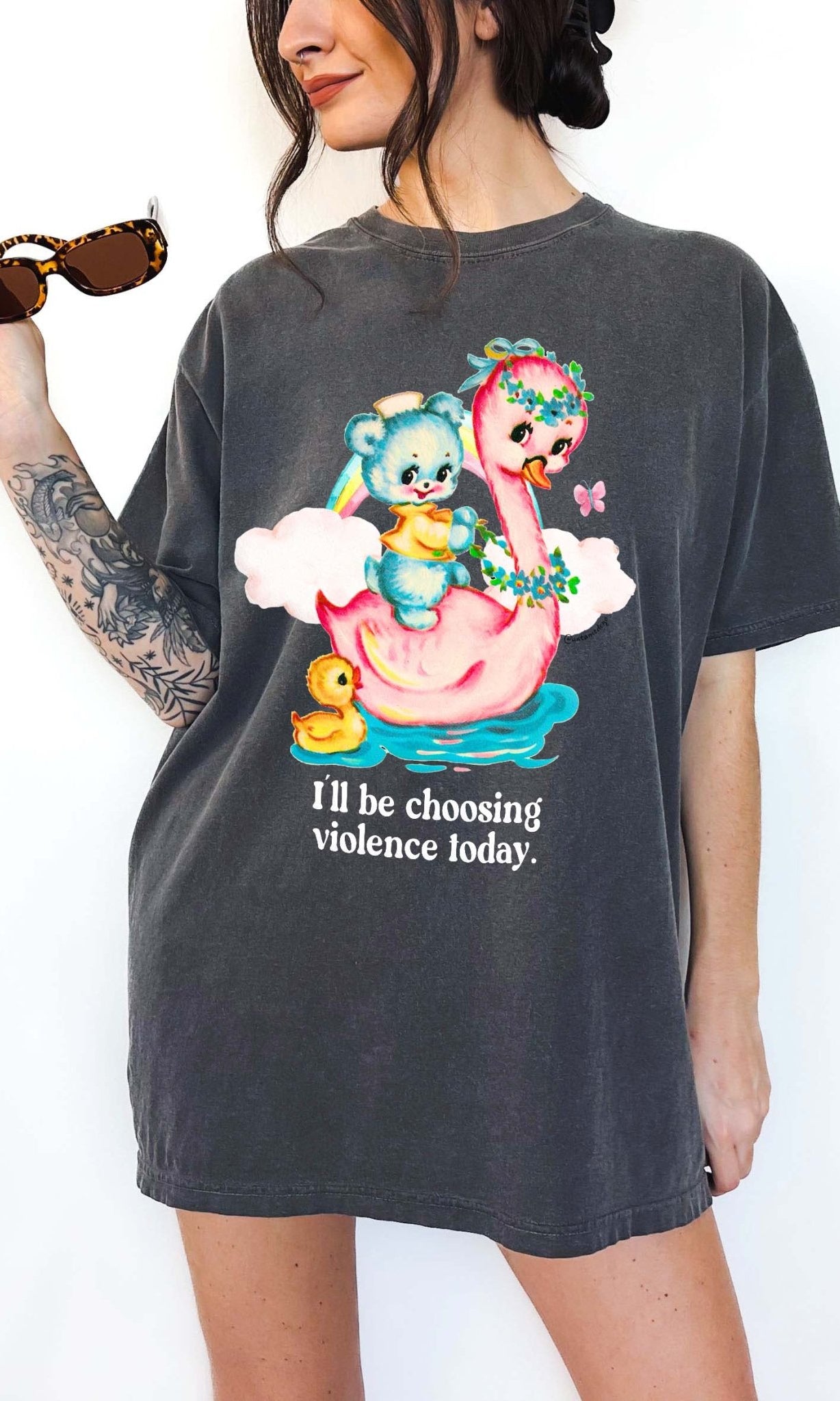 Funny graphic t-shirt with cute duck and swan illustration and text saying I’ll be choosing violence today