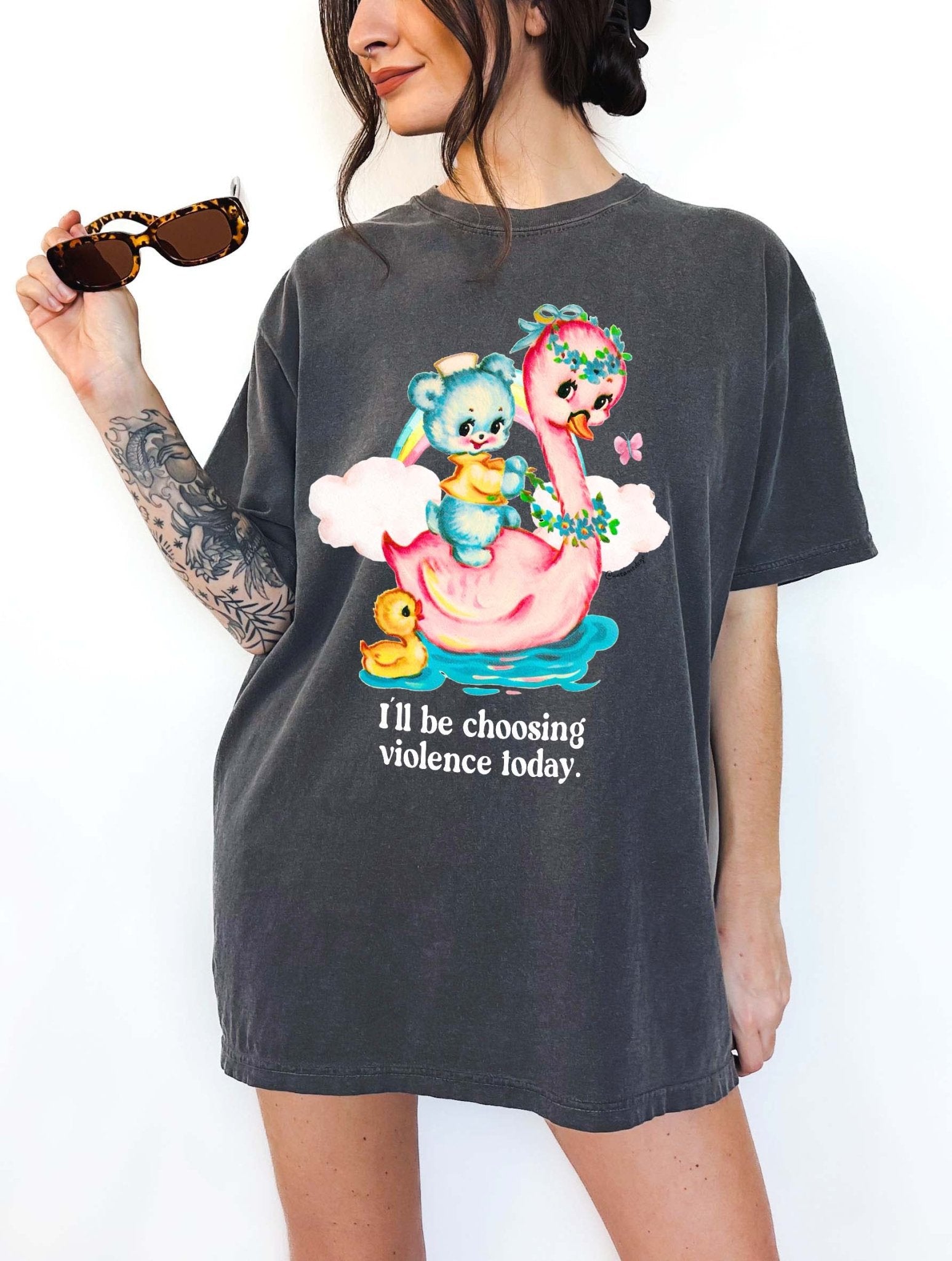 Funny graphic t-shirt with cute duck and swan illustration and text saying I’ll be choosing violence today