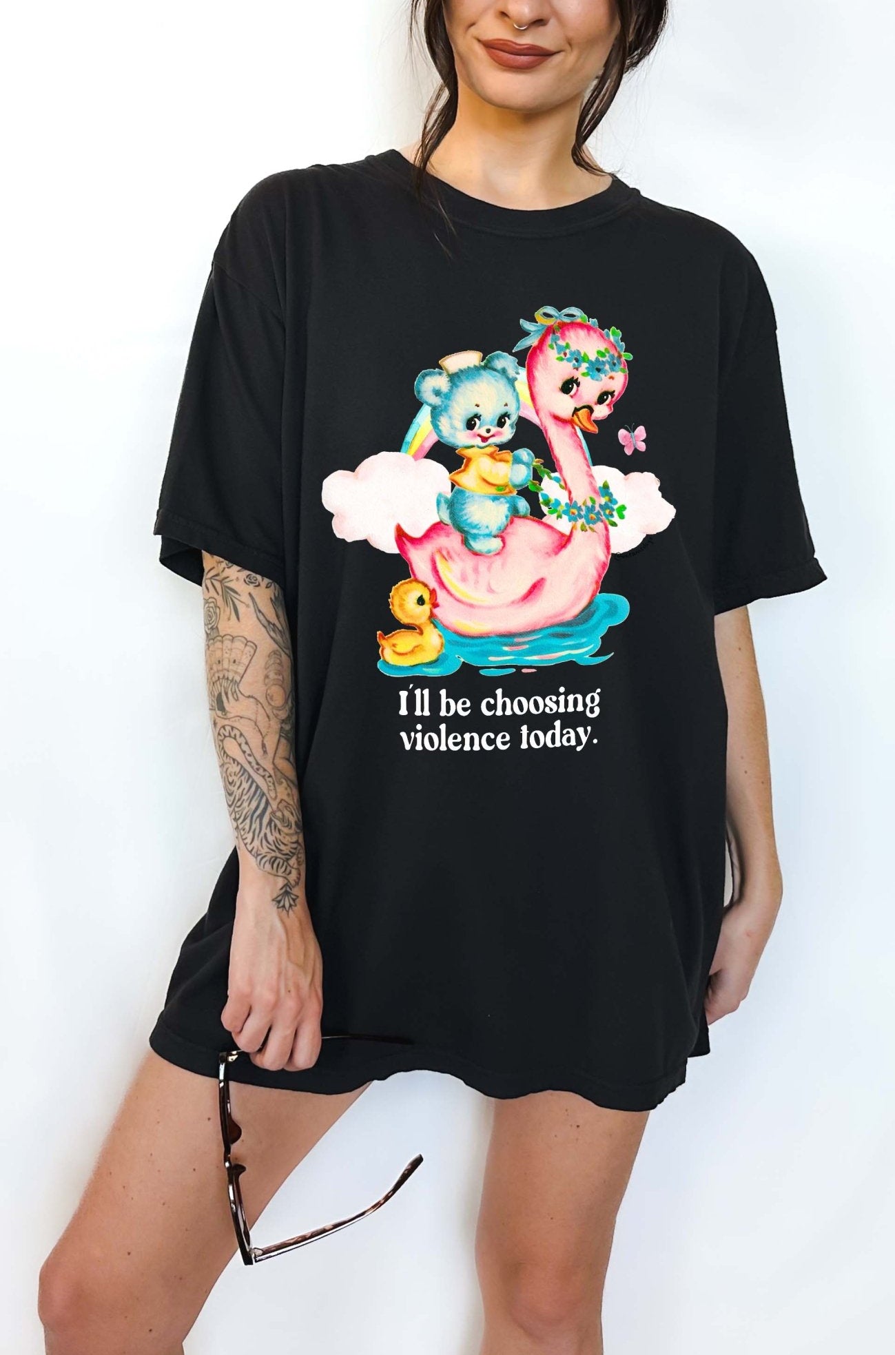 Funny graphic t-shirt with cute duck and swan illustration and text saying I’ll be choosing violence today