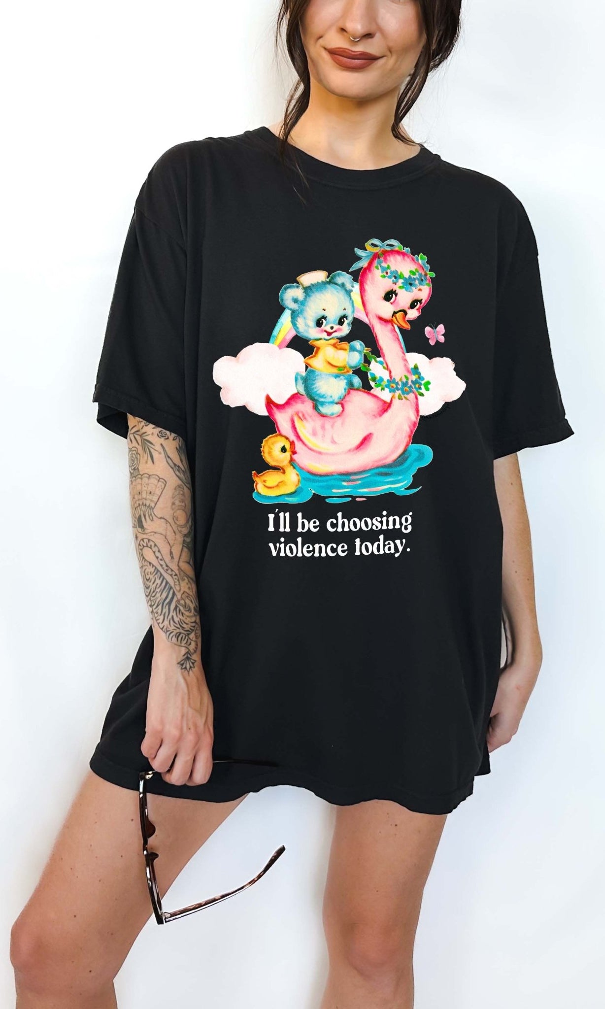 Funny graphic t-shirt with cute duck and swan illustration and text saying I’ll be choosing violence today