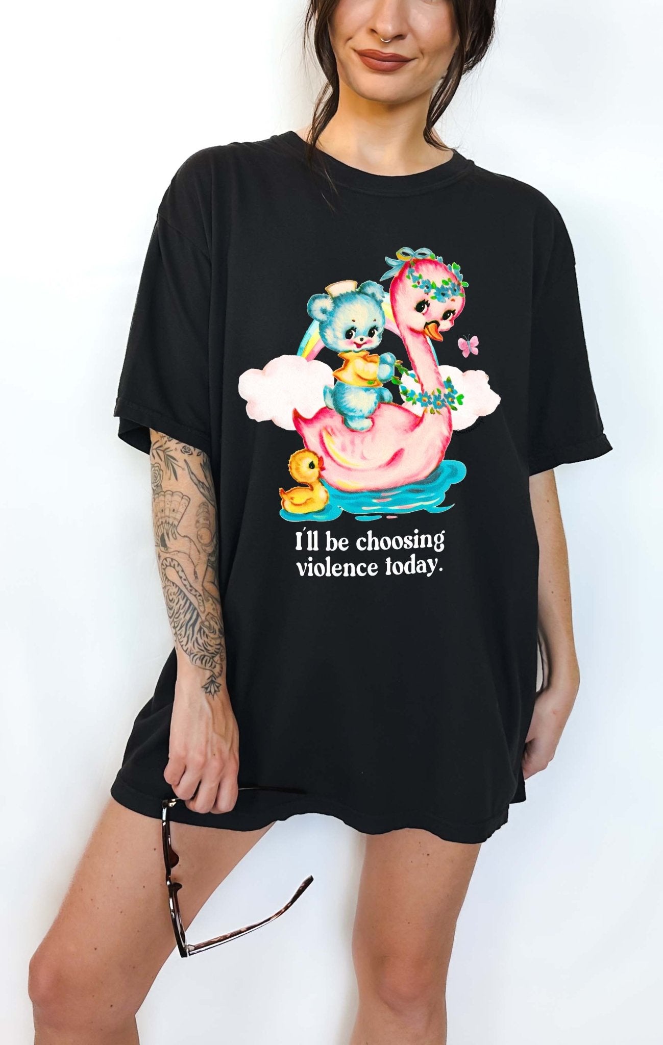 Funny graphic t-shirt with cute duck and swan illustration and text saying I’ll be choosing violence today