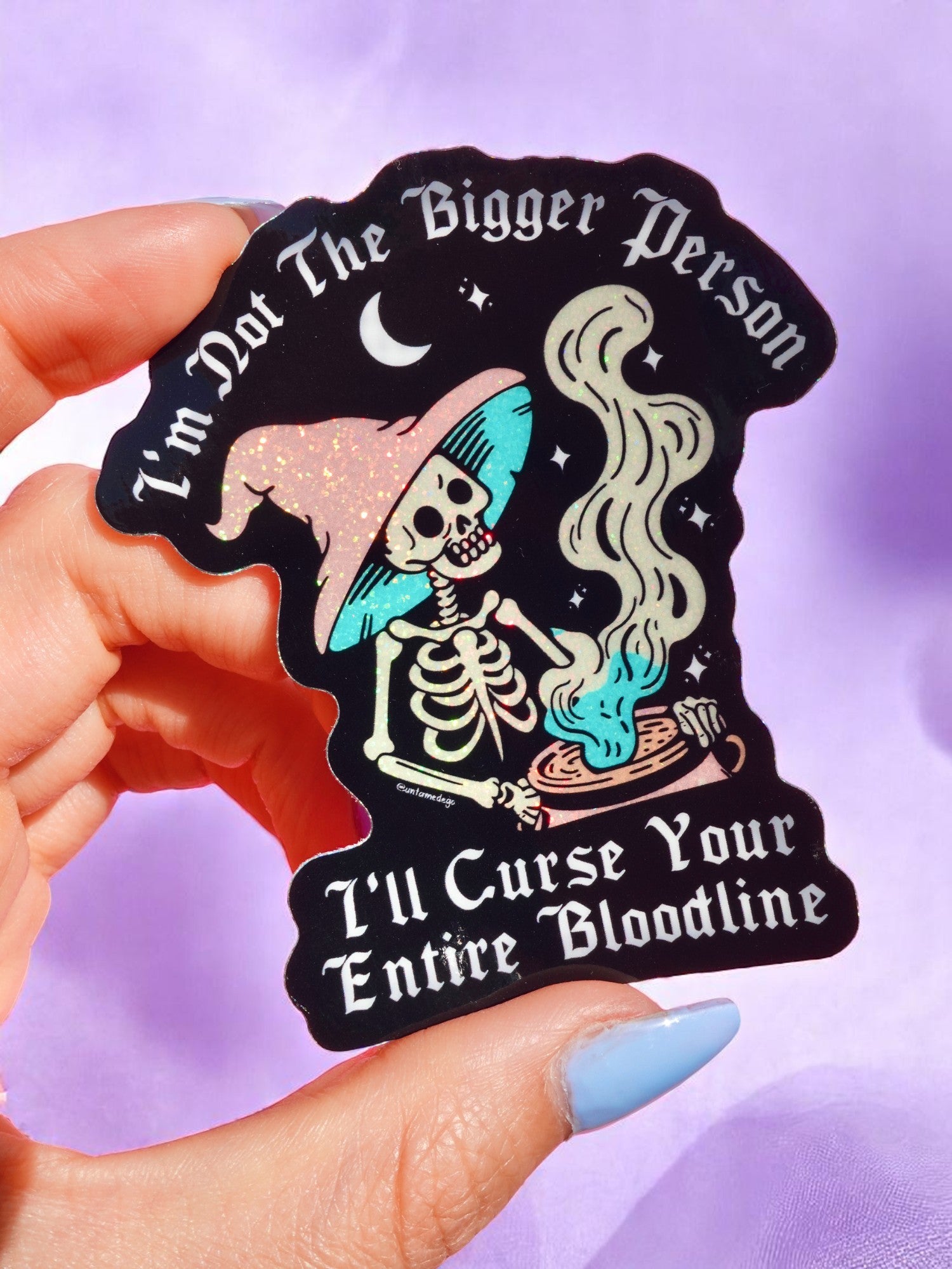 Funny vinyl sticker of skeleton witch stirring cauldron under a crescent moon. Text reads “I’m Not the Bigger Person – I’ll Curse Your Entire Bloodline.” Waterproof and gothic.
