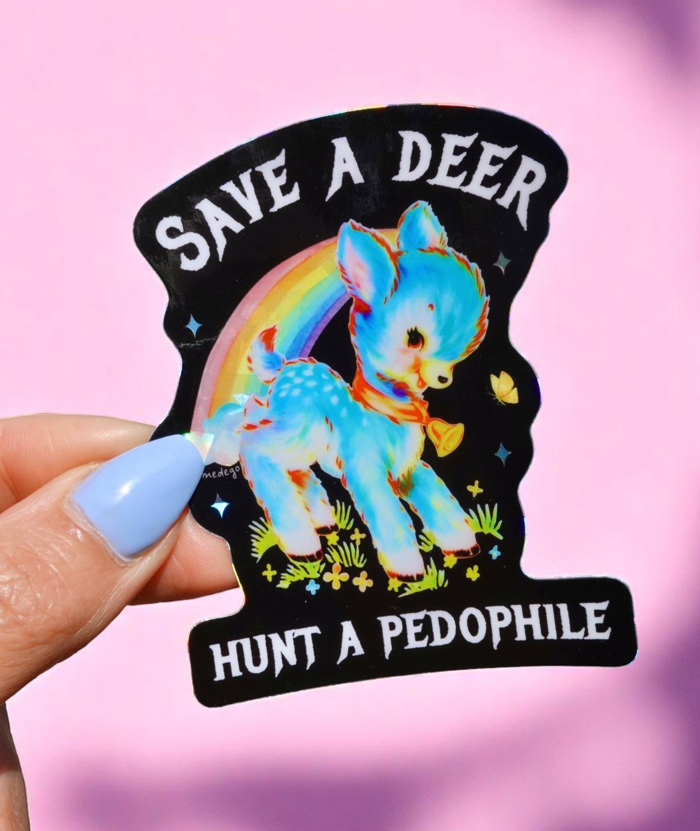 Funny waterproof vinyl sticker with pastel deer under a rainbow. Text says “Save a Deer, Hunt a Pedophile.” Glossy finish and dark humor theme.