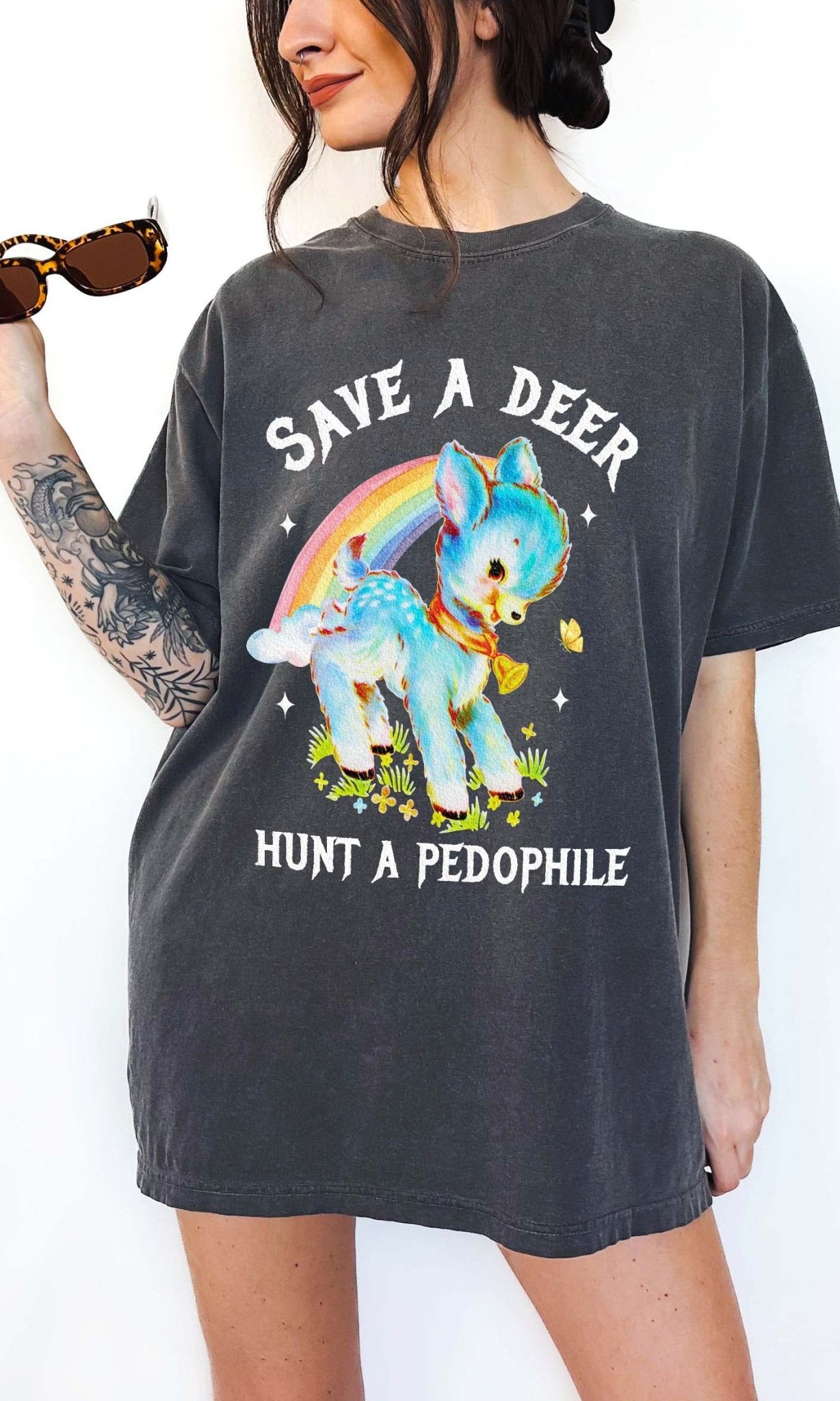 Vintage style deer graphic t-shirt with rainbow design and bold statement text, worn oversized on a model