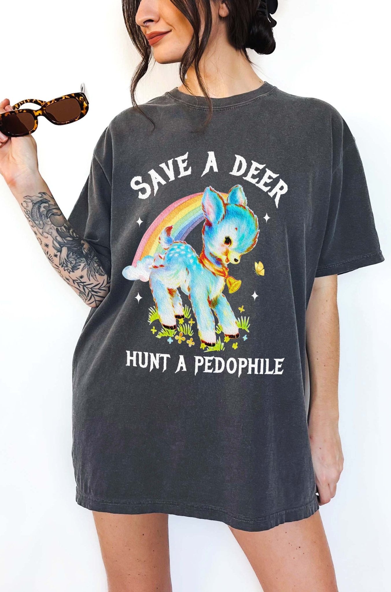 Vintage style deer graphic t-shirt with rainbow design and bold statement text, worn oversized on a model