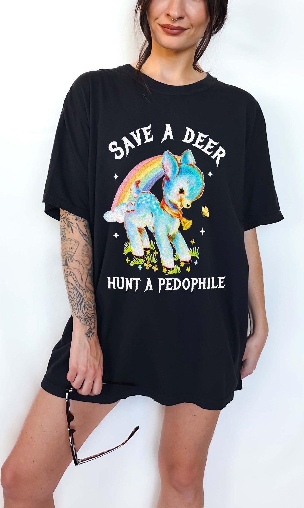 Vintage style deer graphic t-shirt with rainbow design and bold statement text, worn oversized on a model