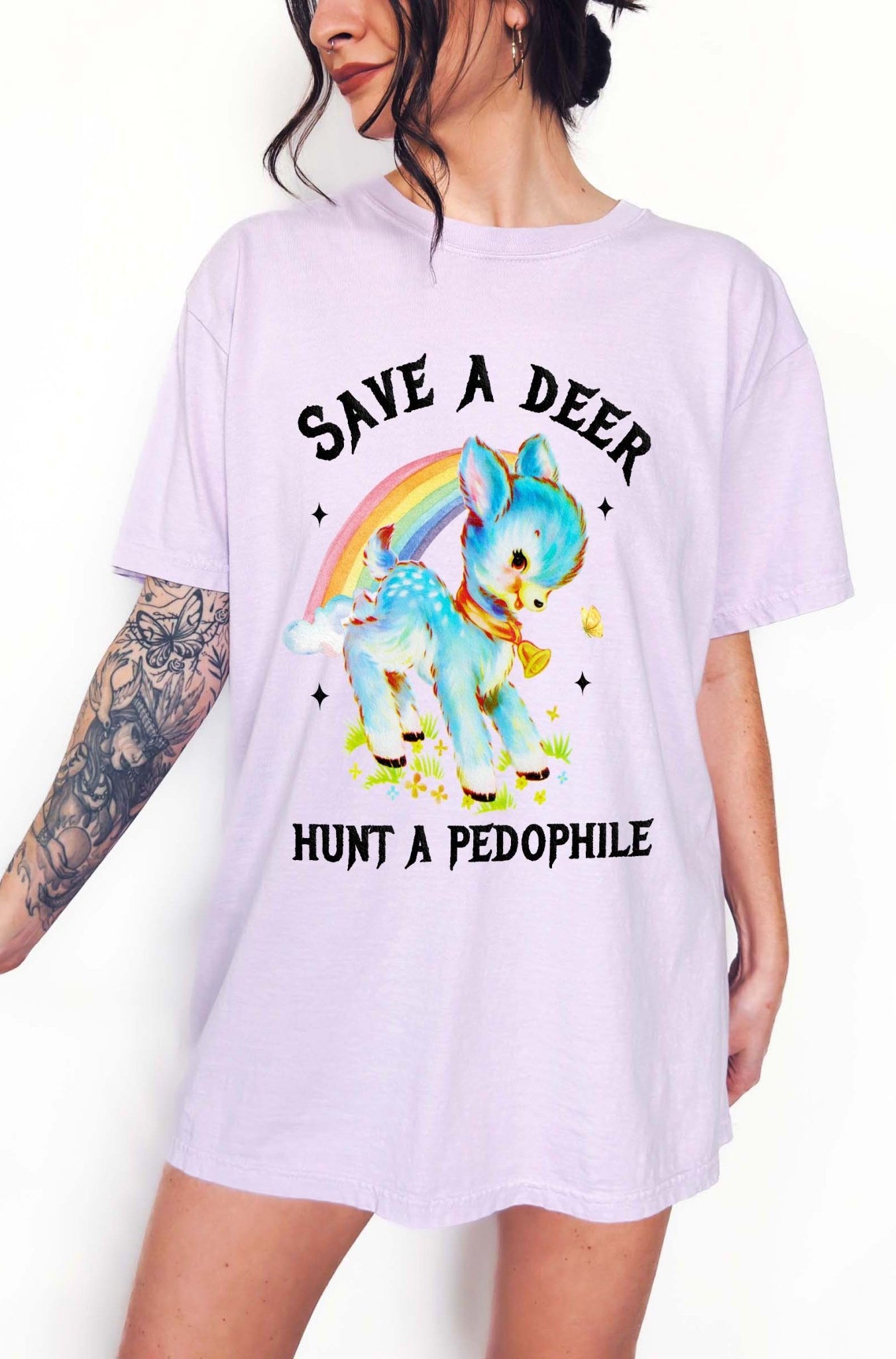 Vintage style deer graphic t-shirt with rainbow design and bold statement text, worn oversized on a model
