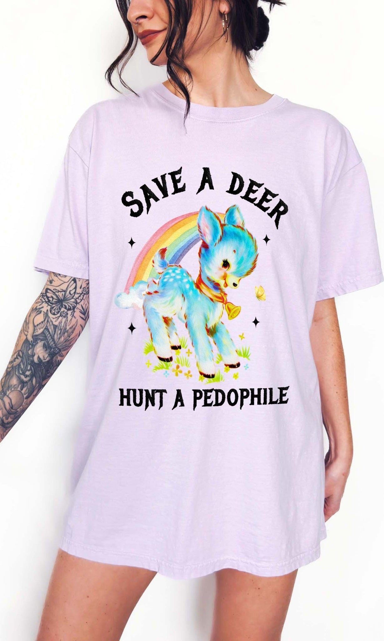 Vintage style deer graphic t-shirt with rainbow design and bold statement text, worn oversized on a model