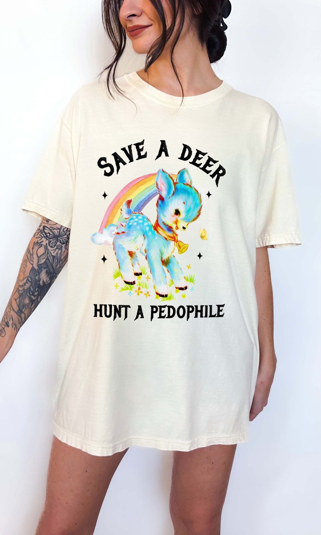 Vintage style deer graphic t-shirt with rainbow design and bold statement text, worn oversized on a model