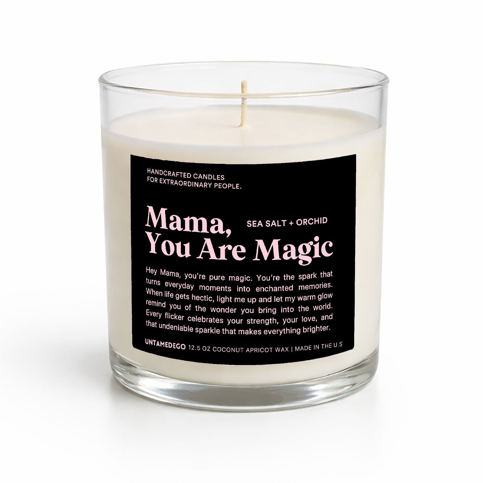 Candle in a glass jar with a black label on a white background