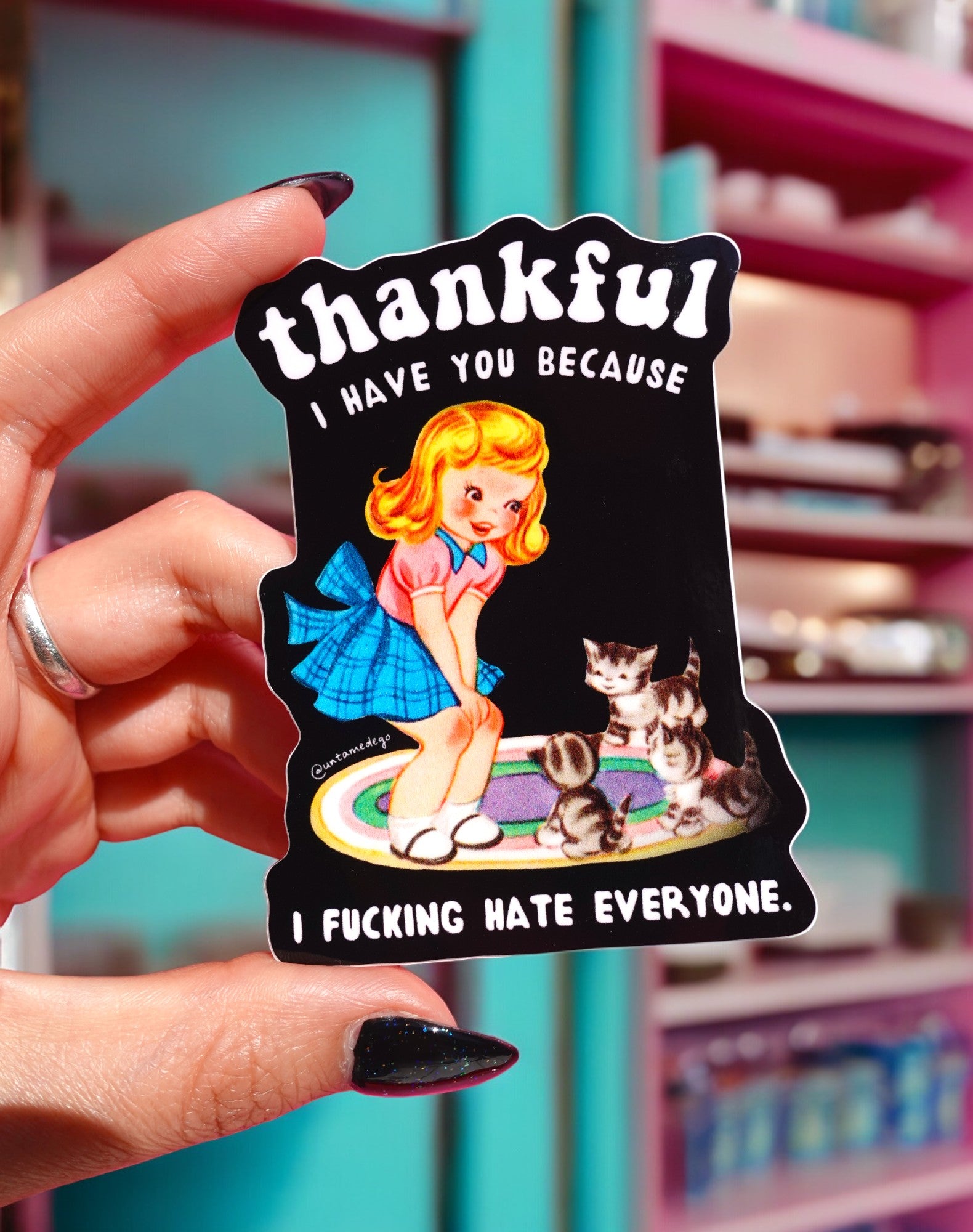 Funny vinyl sticker with retro-style girl and kittens on a rug. Text reads “Thankful I Have You Because I F*cking Hate Everyone.”