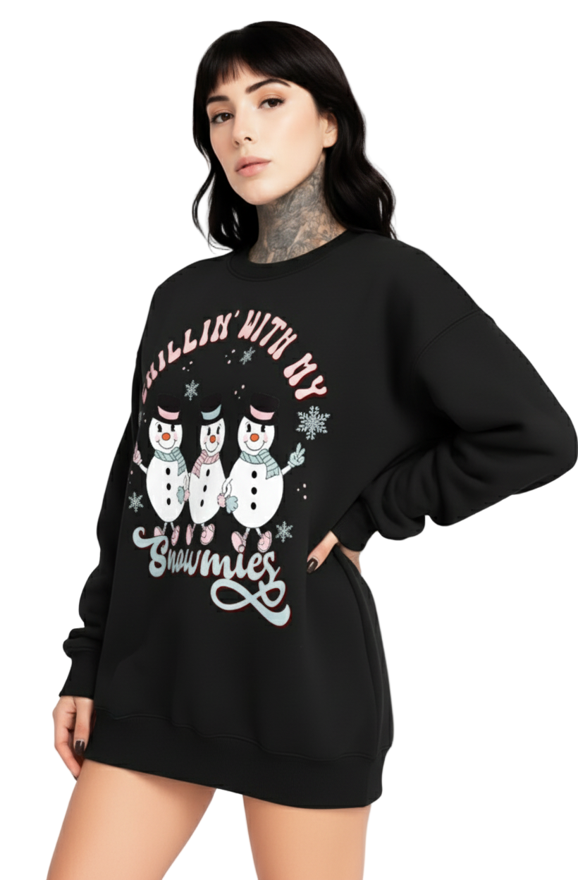 Person wearing a black sweatshirt with snowman graphic and text on a white background