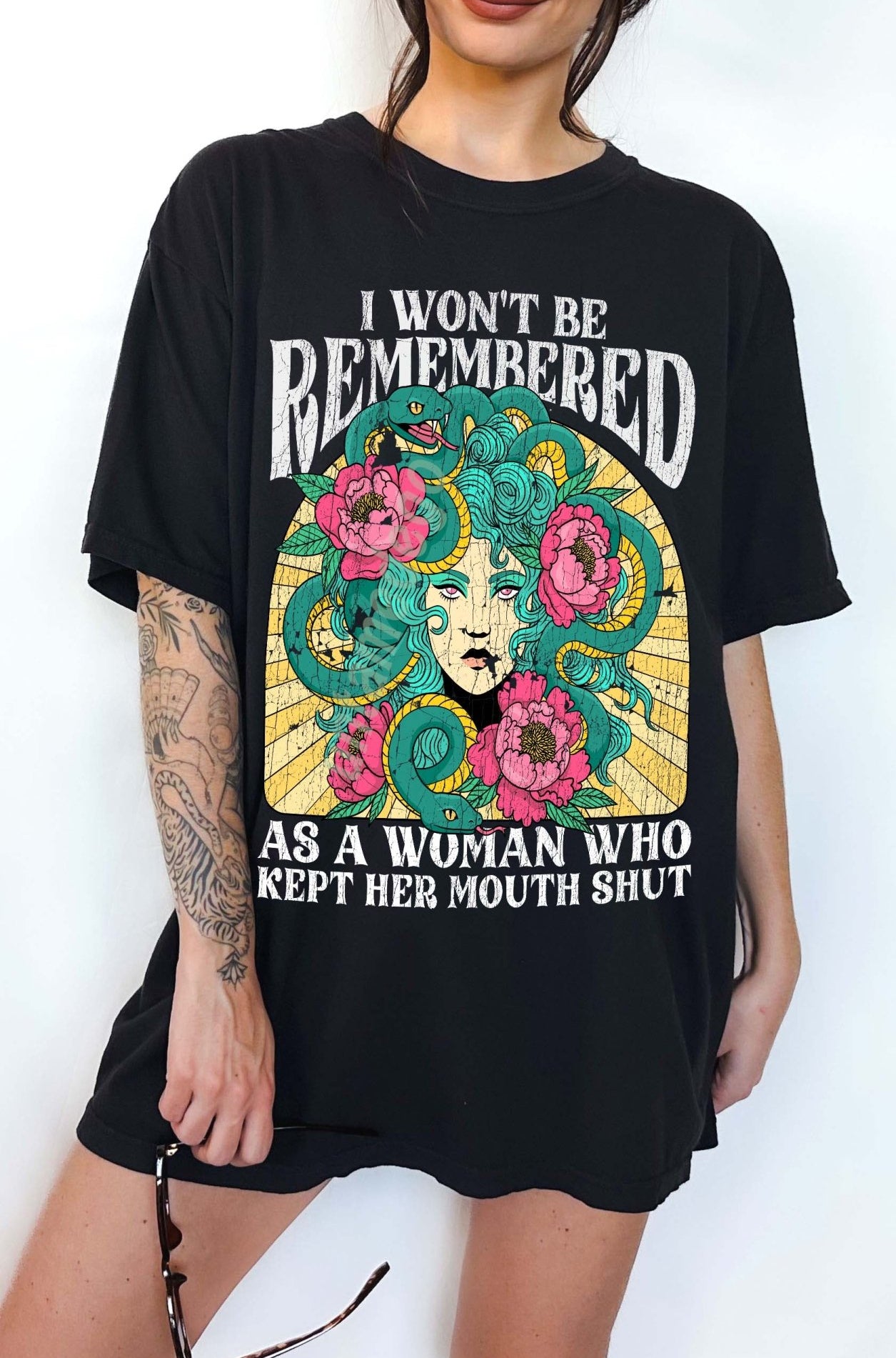Women empowerment graphic t-shirt with Medusa design and bold feminist statement text
