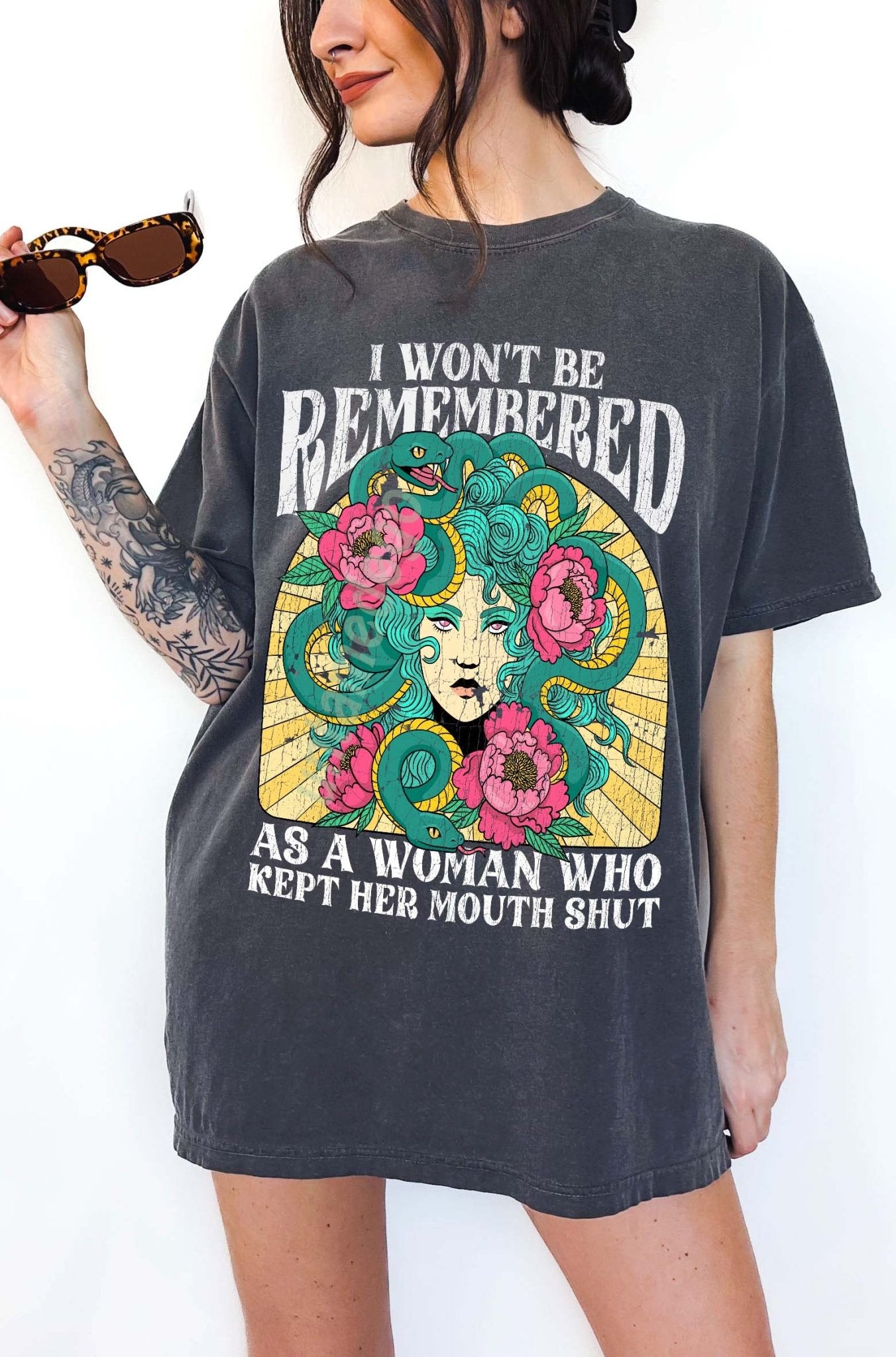 Women empowerment graphic t-shirt with Medusa design and bold feminist statement text