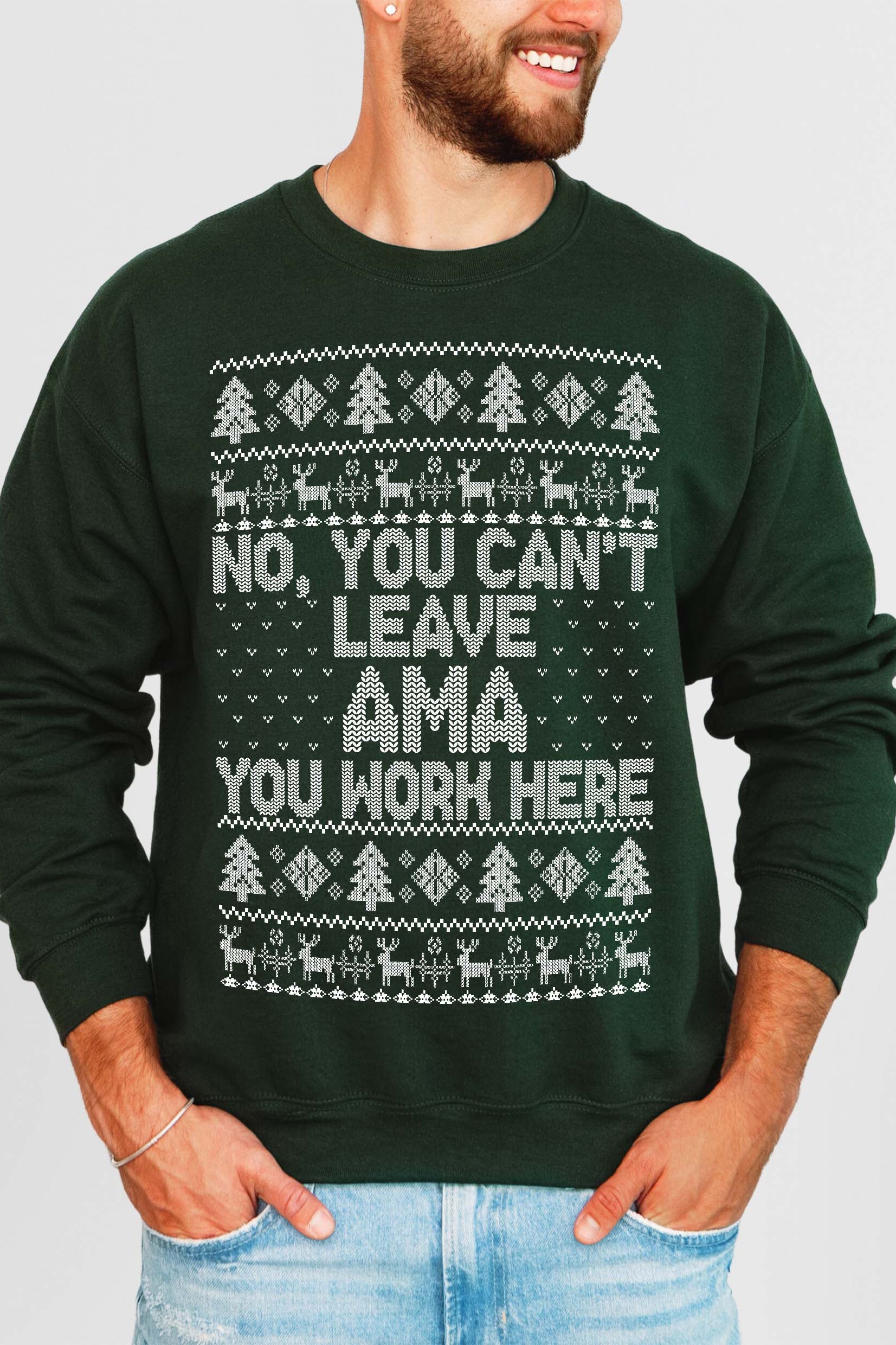 Person wearing a green sweater with a humorous message on a plain background