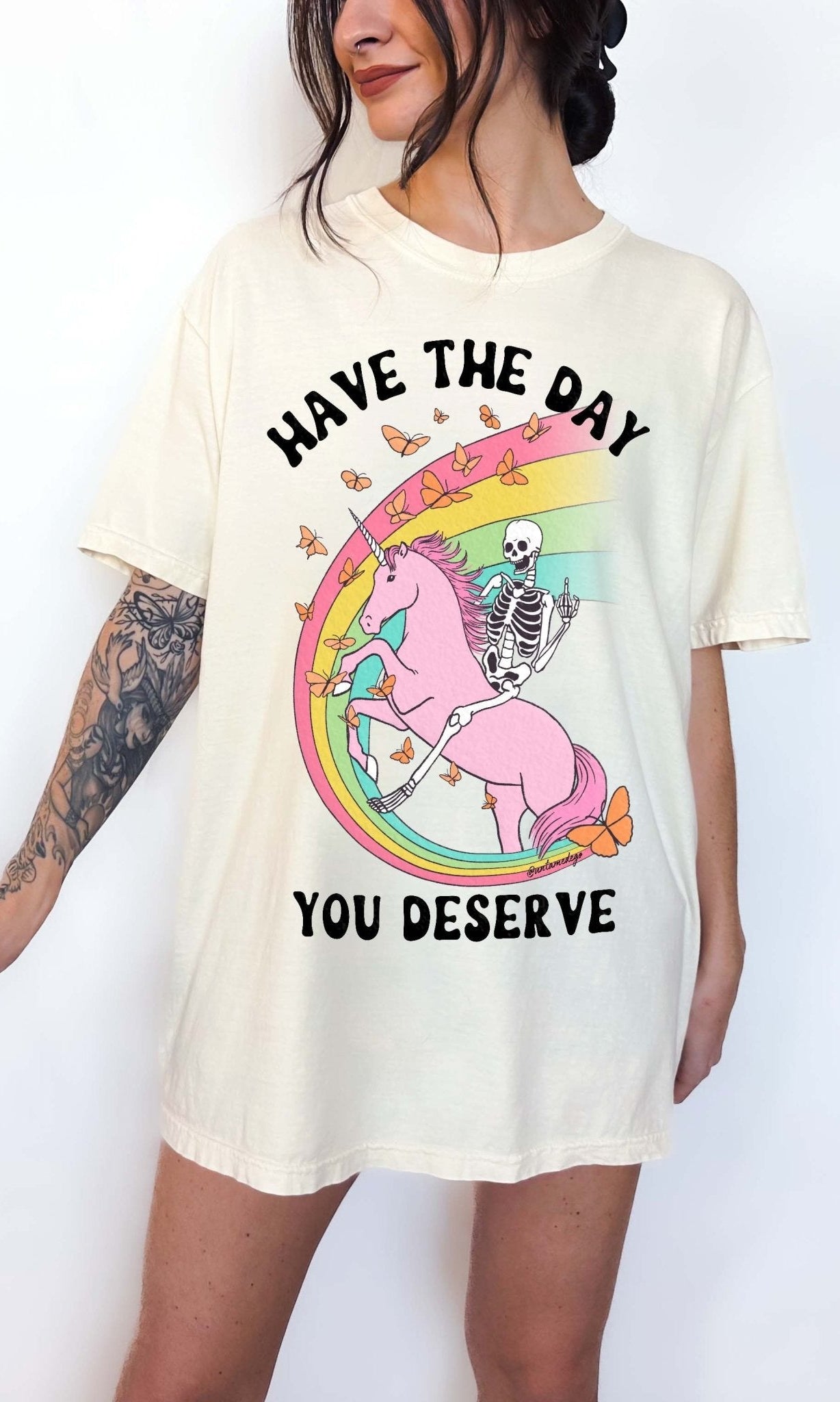 Funny sarcastic t-shirt with unicorn and skeleton design and text saying have the day you deserve