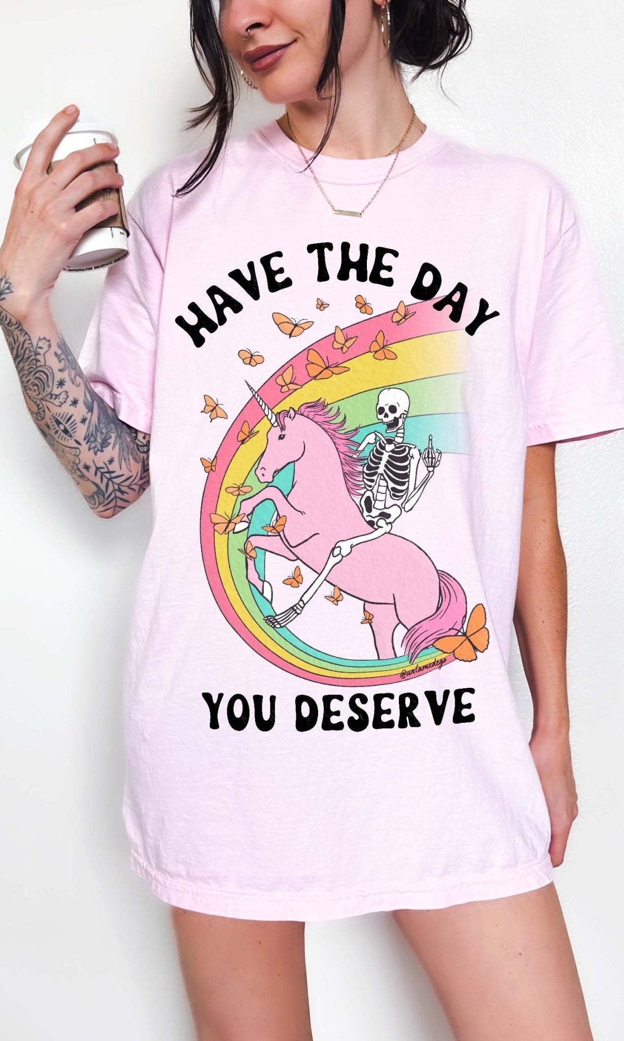 Funny sarcastic t-shirt with unicorn and skeleton design and text saying have the day you deserve