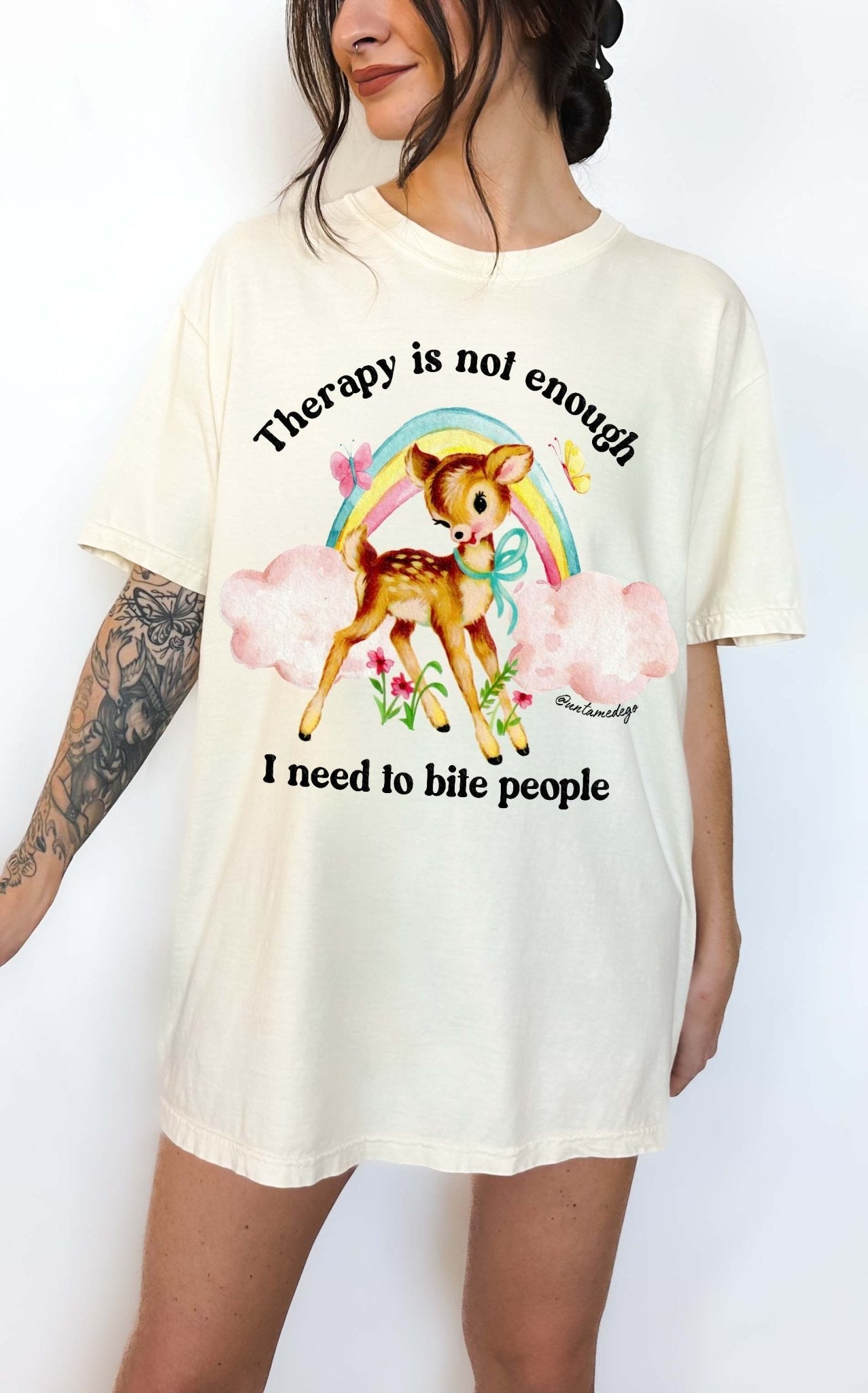 Funny graphic t-shirt with cute deer illustration and text saying therapy is not enough I need to bite people