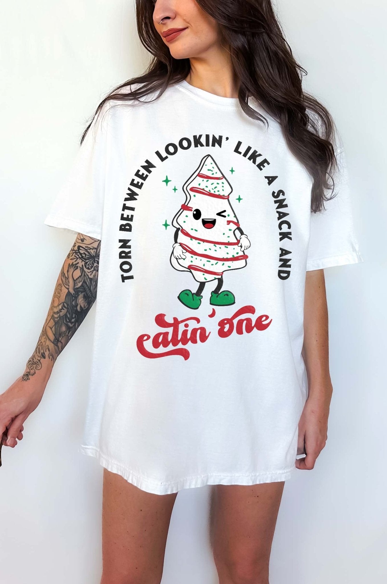 Torn Between Lookin Like A Snack And Eatin One Christmas Tee - UntamedEgo LLC.