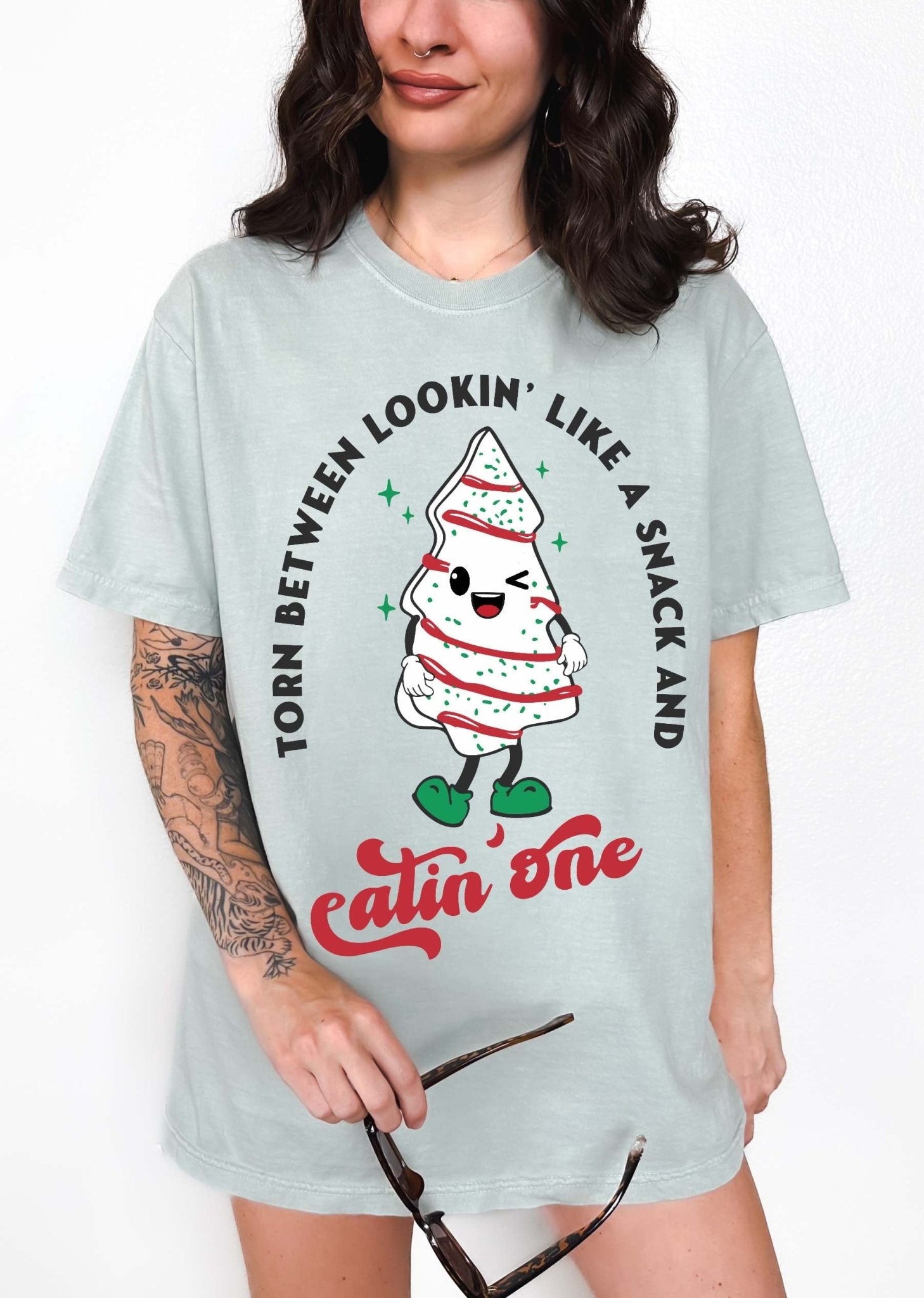 Torn Between Lookin Like A Snack And Eatin One Christmas Tee - UntamedEgo LLC.