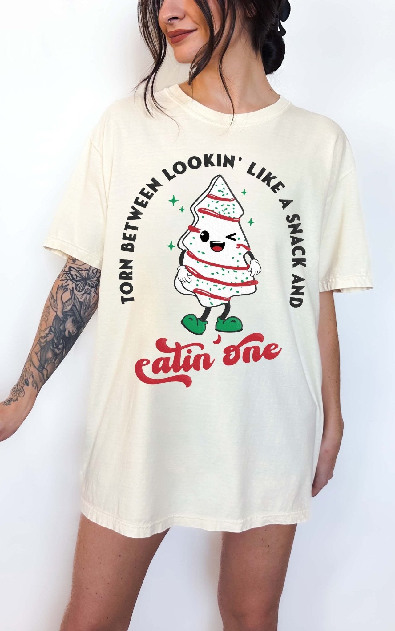 Torn Between Lookin Like A Snack And Eatin One Christmas Tee - UntamedEgo LLC.