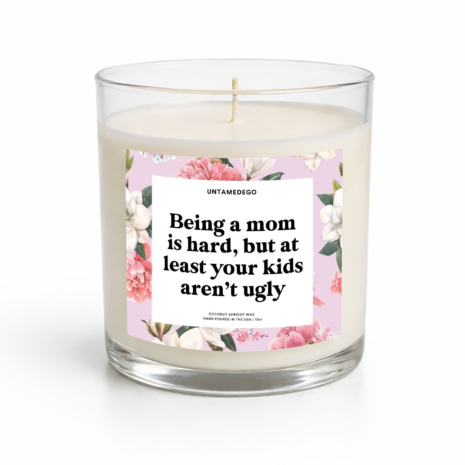 Candle with a floral label on a white background