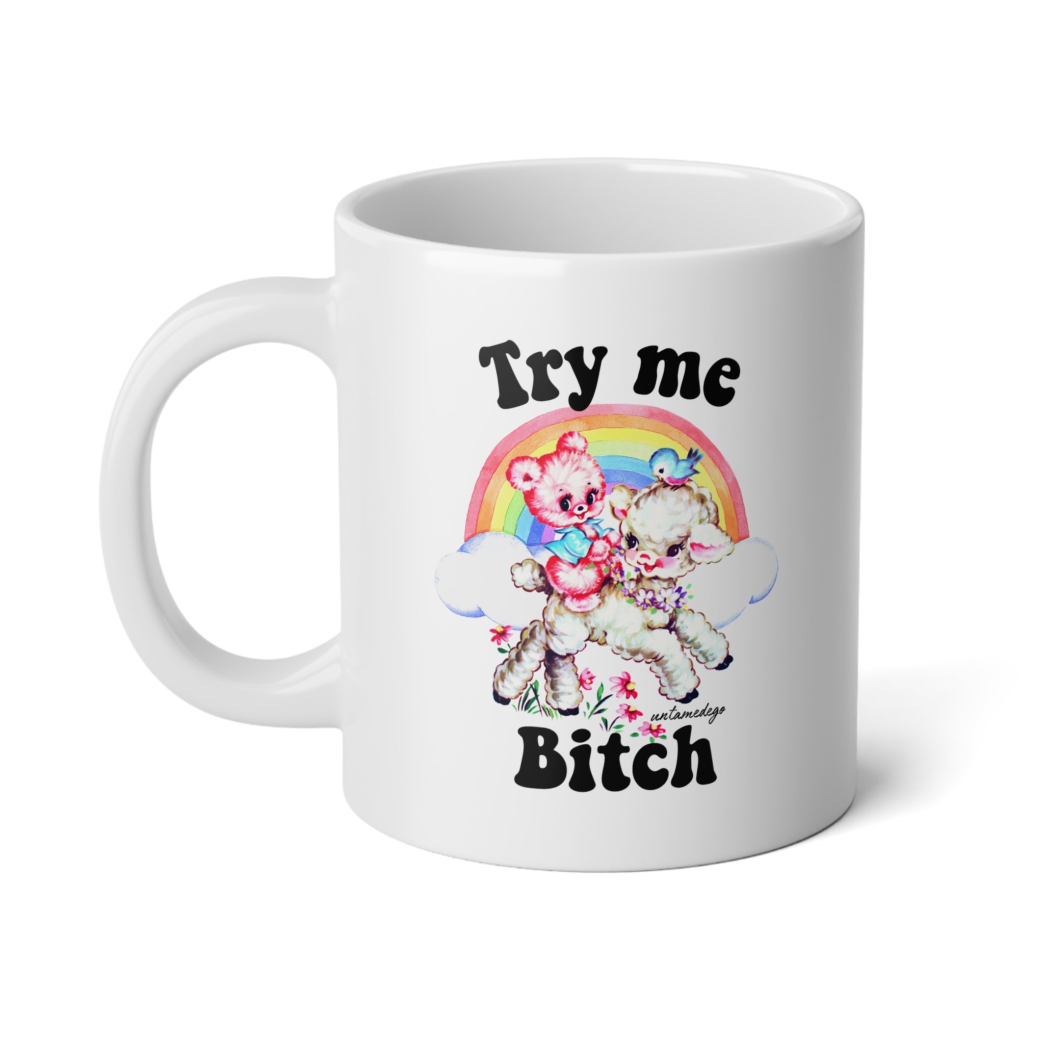 A white ceramic mug with a printed graphic featuring two teddy bears under a rainbow and the text 'Try me Bitch' in black lettering.
