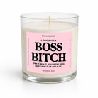 A sea salt and orchid scented candle in a clear glass jar with a pink label that reads 'UNTAMEDOGO A CANDLE FOR A BOSS BITCH' on a white background.