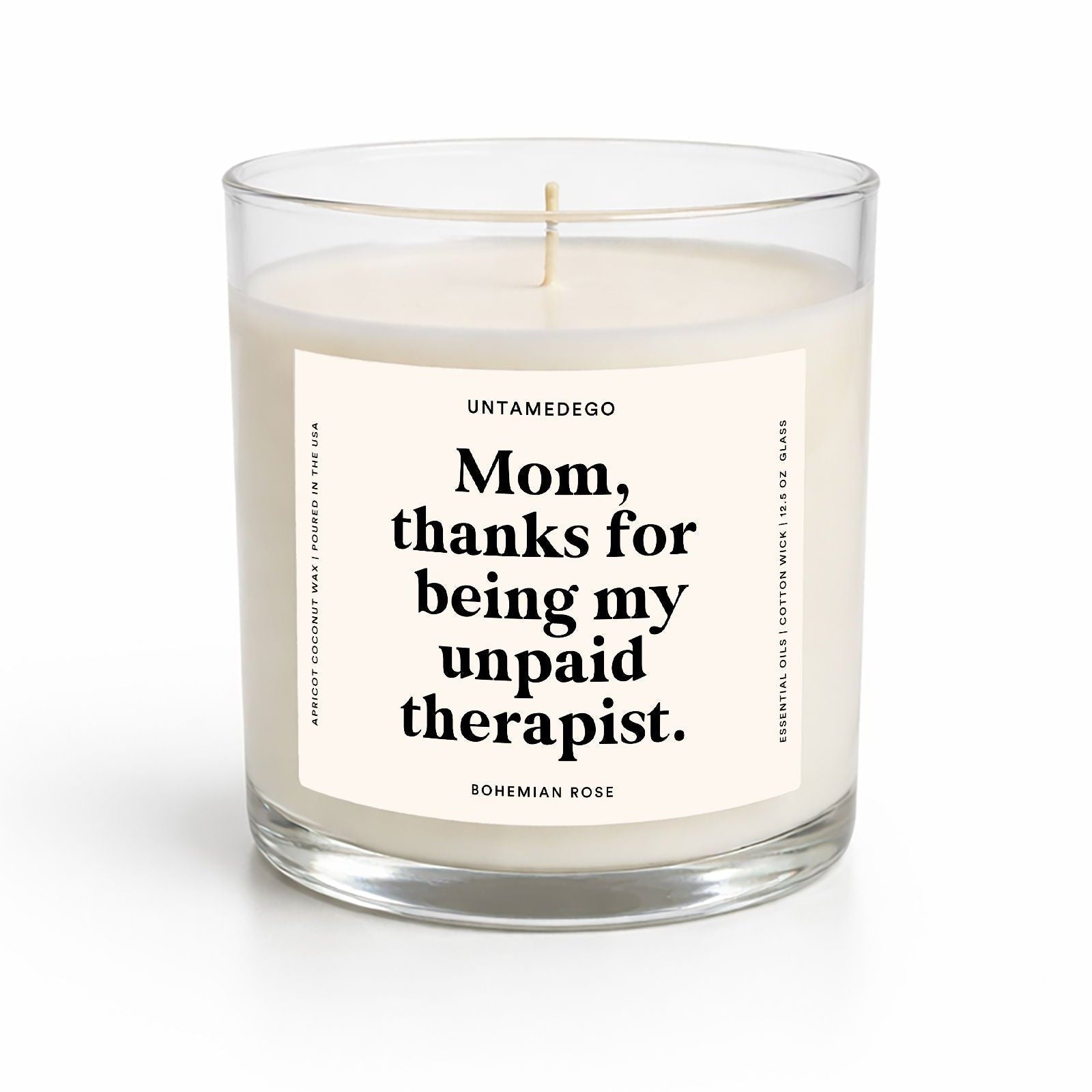 Candle in a glass jar with a label on a white background