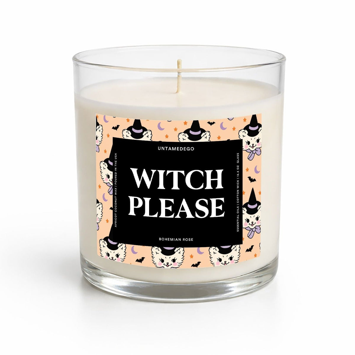A clear glass jar candle with white wax and a printed label reading 'WITCH PLEASE' on a peach background with cartoon cats, witches, and small purple butterflies. The candle is photographed on a clean white background.