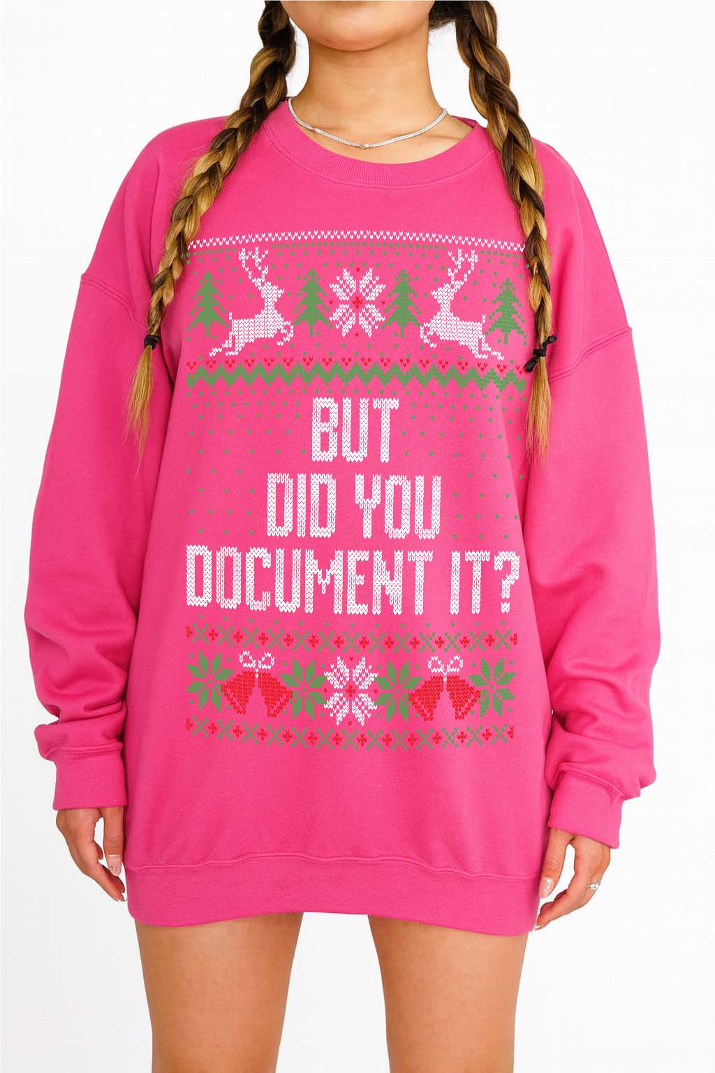 A bright pink crewneck sweatshirt with a festive Christmas sweater graphic and the text 'BUT DID YOU DOCUMENT IT?' printed on the front, shown on a model with braided hair.