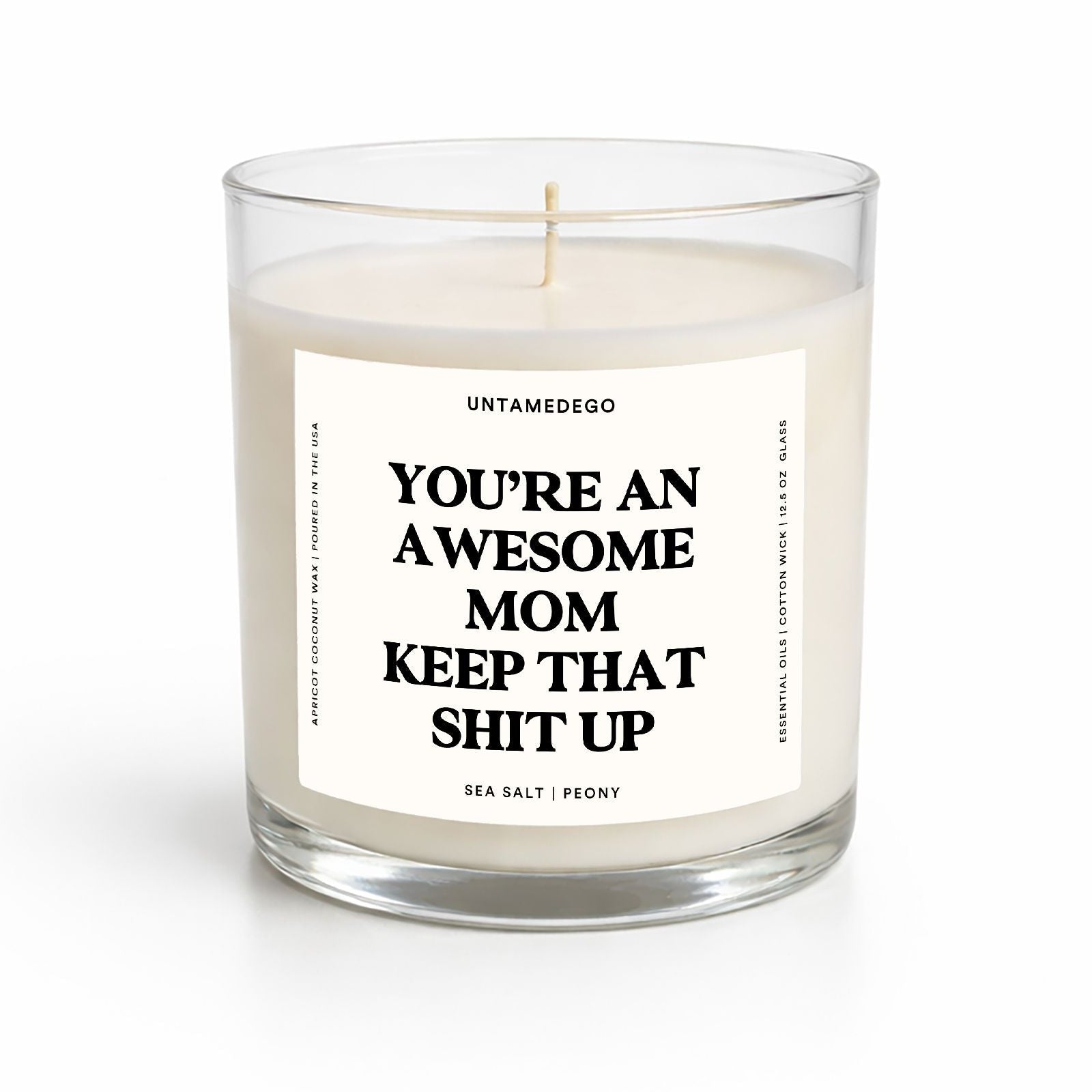 Candle in a glass jar with a label on a white background