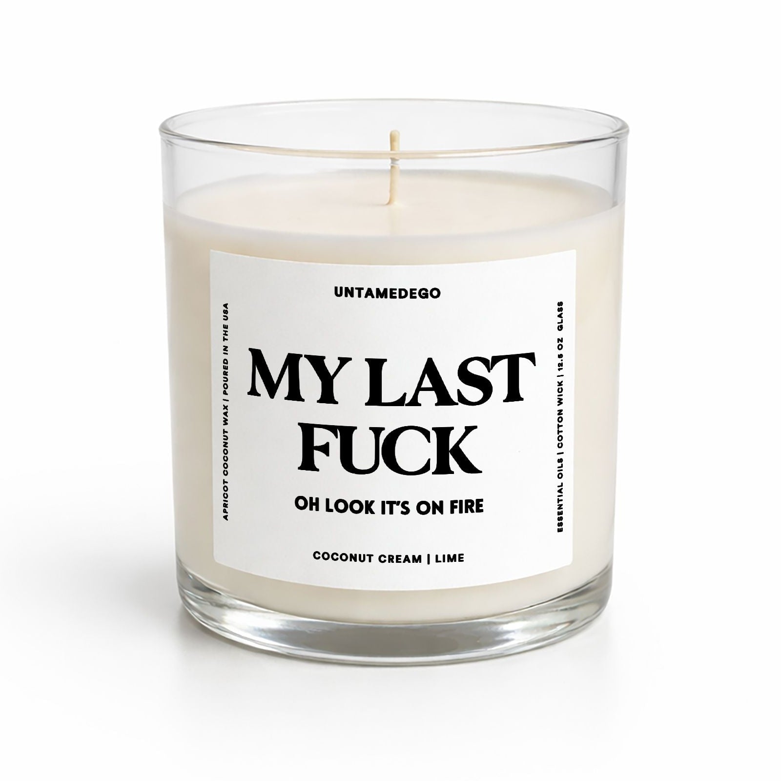 Candle in a glass jar with a label on a white background