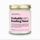 Candle jar with pink label on a white background