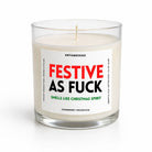 A glass jar candle with white wax and a white label reading 'FESTIVE AS FUCK' in red and black, with 'SMELLS LIKE CHRISTMAS SPIRIT' in green and 'CRANBERRY WOODS' at the bottom. The candle is photographed on a clean white background.